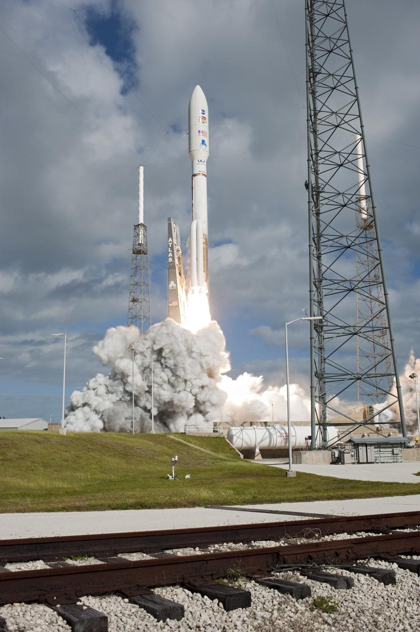 CAPE CANAVERAL, Fla. -- The United Launch Alliance Atlas V rocket carrying NASA's Mars Science Laboratory (MSL) spacecraft rides a plume of flames as it lifts off from Space Launch Complex-41 at Cape Canaveral Air Force Station in Florida at 10:02 a.m. EST Nov. 26. MSL's components include a car-sized rover, Curiosity, which has 10 science instruments designed to search for signs of life, including methane, and help determine if the gas is from a biological or geological source. For more information, visit http://www.nasa.gov/msl. Photo credit: NASA/Tony Gray and Rick Wetherington