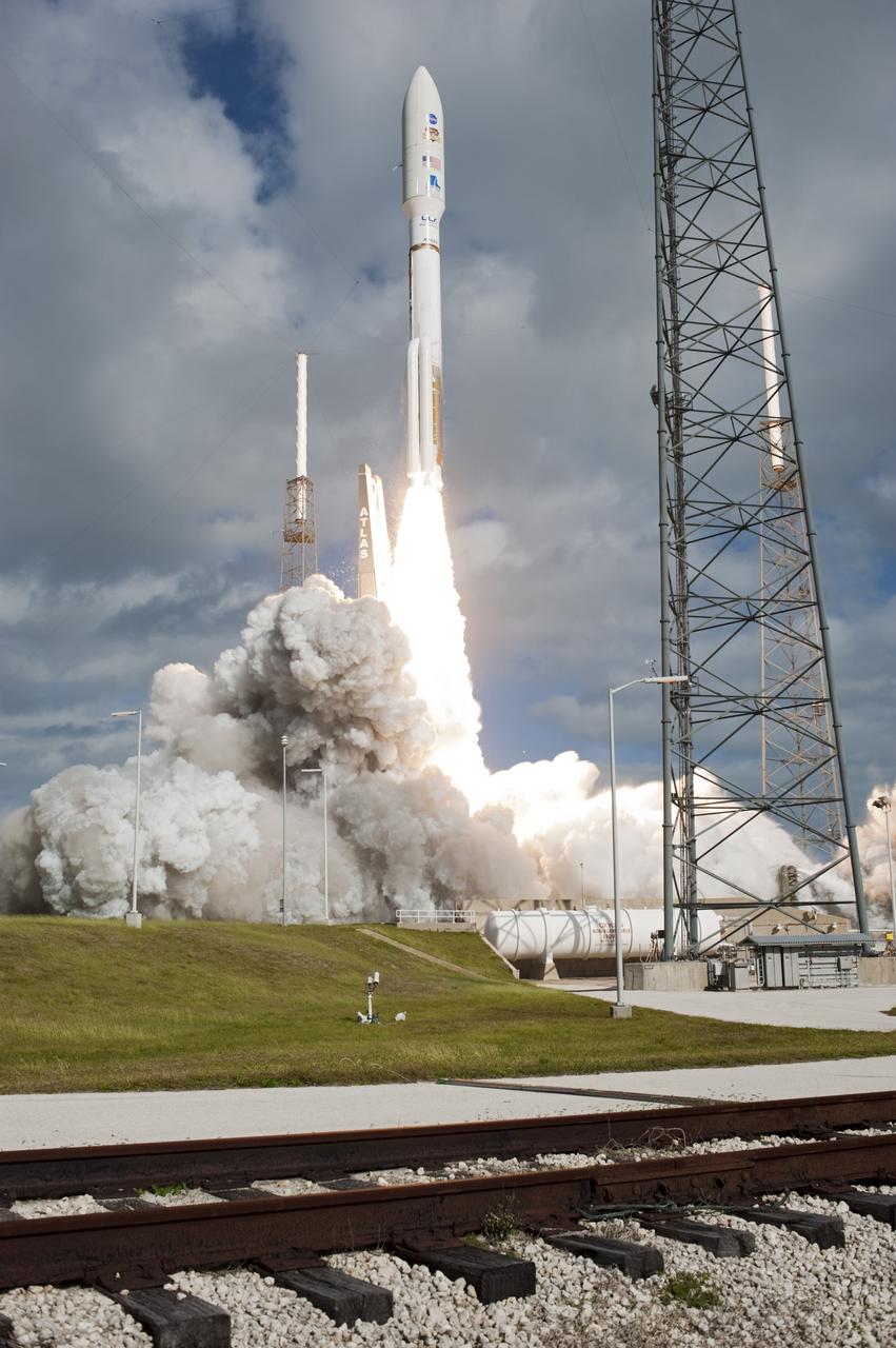 CAPE CANAVERAL, Fla. -- The United Launch Alliance Atlas V rocket carrying NASA's Mars Science Laboratory (MSL) spacecraft rides a plume of flames as it clears the tower at Space Launch Complex-41 at Cape Canaveral Air Force Station in Florida at 10:02 a.m. EST Nov. 26. MSL's components include a car-sized rover, Curiosity, which has 10 science instruments designed to search for signs of life, including methane, and help determine if the gas is from a biological or geological source. For more information, visit http://www.nasa.gov/msl. Photo credit: NASA/Tony Gray and Rick Wetherington