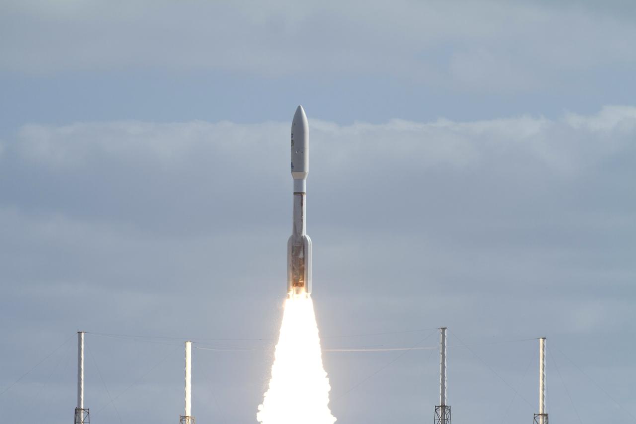 CAPE CANAVERAL, Fla. -- With NASA's Mars Science Laboratory (MSL) spacecraft sealed inside its payload fairing, the United Launch Alliance Atlas V rocket rides a plume of flames as it roars off the launch pad at Space Launch Complex-41 on Cape Canaveral Air Force Station in Florida at 10:02 a.m. EST Nov. 26. MSL's components include a car-sized rover, Curiosity, which has 10 science instruments designed to search for signs of life, including methane, and help determine if the gas is from a biological or geological source. For more information, visit http://www.nasa.gov/msl. Photo credit: NASA/Kenny Allen