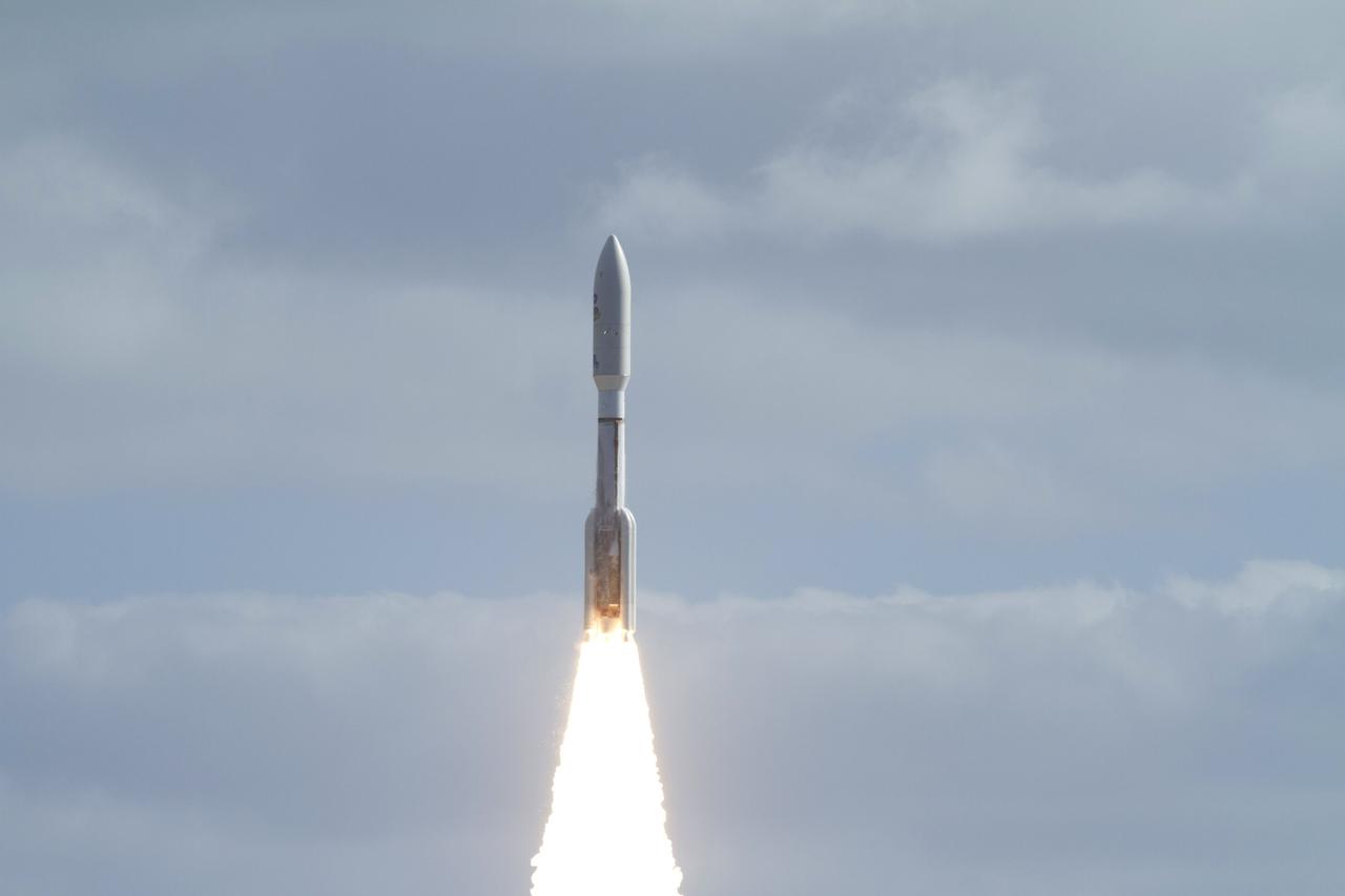 CAPE CANAVERAL, Fla. -- With NASA's Mars Science Laboratory (MSL) spacecraft sealed inside its payload fairing, the United Launch Alliance Atlas V rocket rides a plume of flames as it climbs into the sky over Space Launch Complex-41 on Cape Canaveral Air Force Station in Florida at 10:02 a.m. EST Nov. 26. MSL's components include a car-sized rover, Curiosity, which has 10 science instruments designed to search for signs of life, including methane, and help determine if the gas is from a biological or geological source. For more information, visit http://www.nasa.gov/msl. Photo credit: NASA/Kenny Allen