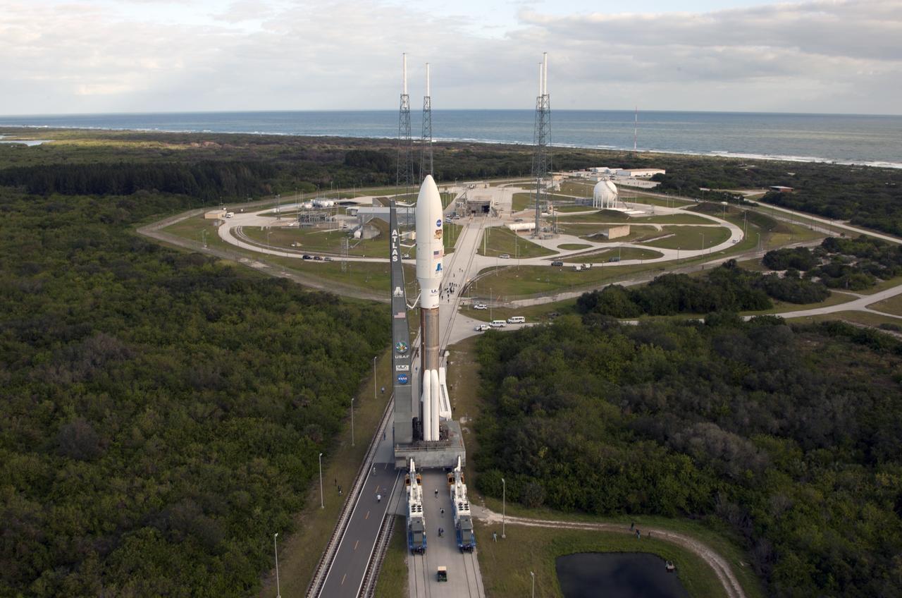 CAPE CANAVERAL, Fla. -- With NASA's Mars Science Laboratory (MSL) spacecraft sealed inside its payload fairing, the United Launch Alliance Atlas V rocket rolls toward the launch pad at Space Launch Complex-41 on Cape Canaveral Air Force Station in Florida. MSL's components include a car-sized rover, Curiosity, which has 10 science instruments designed to search for signs of life, including methane, and help determine if the gas is from a biological or geological source. For more information, visit http://www.nasa.gov/msl. Courtesy: Scott Andrews/Canon