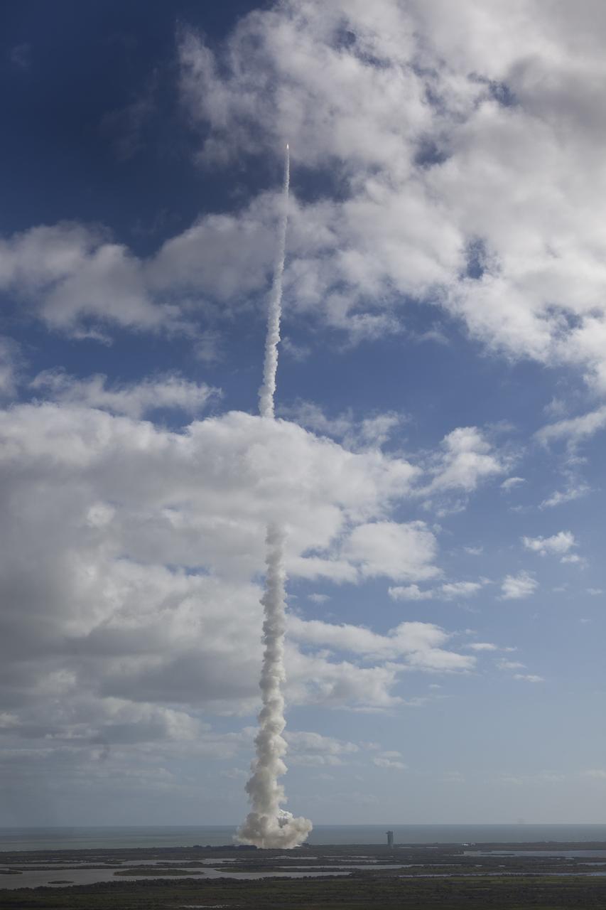 CAPE CANAVERAL, Fla. -- With NASA's Mars Science Laboratory (MSL) spacecraft sealed inside its payload fairing, the United Launch Alliance Atlas V rocket rides a tall pillar of smoke and flames as it soars over Space Launch Complex-41 on Cape Canaveral Air Force Station in Florida, after liftoff at 10:02 a.m. EST Nov. 26.          MSL's components include a car-sized rover, Curiosity, which has 10 science instruments designed to search for signs of life, including methane, and help determine if the gas is from a biological or geological source. For more information, visit http://www.nasa.gov/msl. Courtesy: Scott Andrews/Canon