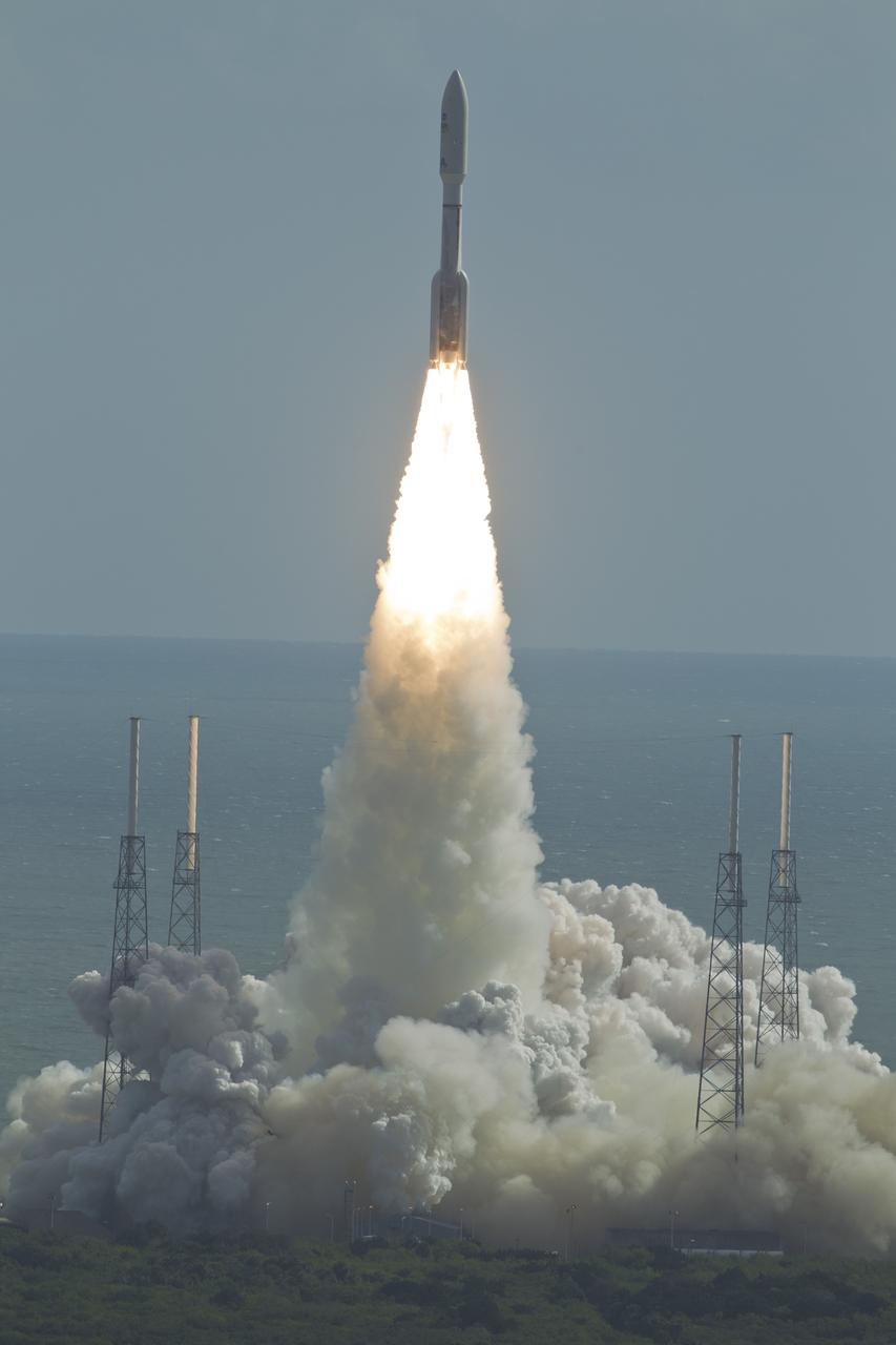 CAPE CANAERAL, Fla. -- With NASA's Mars Science Laboratory (MSL) spacecraft sealed inside its payload fairing, the United Launch Alliance Atlas V rocket rides smoke and flames as it rises from the launch pad at Space Launch Complex-41 on Cape Canaveral Air Force Station in Florida at 10:02 a.m. EST Nov. 26. MSL's components include a car-sized rover, Curiosity, which has 10 science instruments designed to search for signs of life, including methane, and help determine if the gas is from a biological or geological source. For more information, visit http://www.nasa.gov/msl. Courtesy: Scott Andrews/Canon