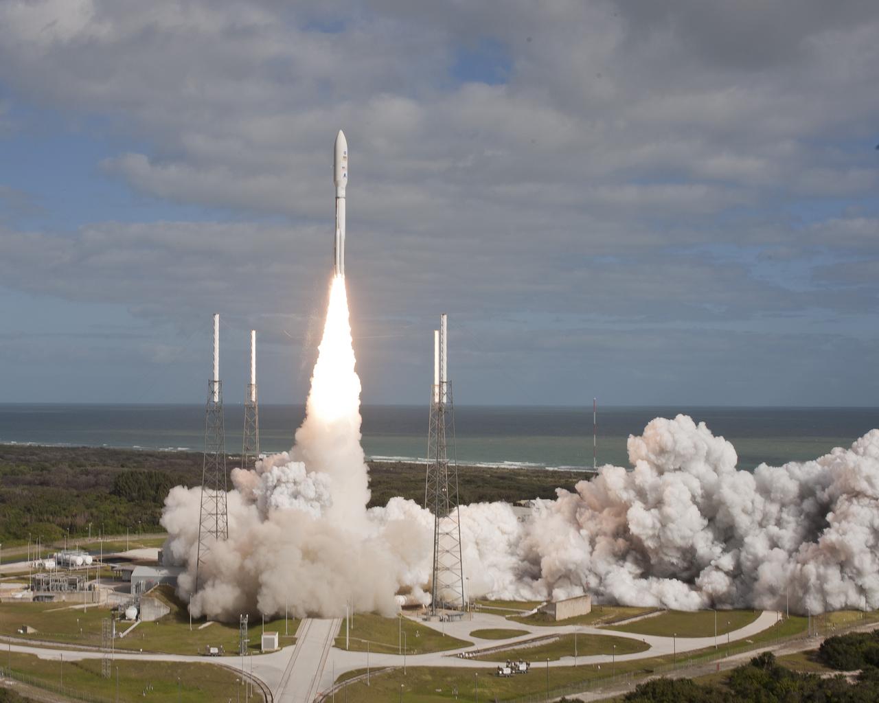 CAPE CANAVERAL, Fla. -- With NASA's Mars Science Laboratory (MSL) spacecraft sealed inside its payload fairing, the United Launch Alliance Atlas V rocket rides smoke and flames as it rises from the launch pad at Space Launch Complex-41 on Cape Canaveral Air Force Station in Florida at 10:02 a.m. EST Nov. 26. MSL's components include a car-sized rover, Curiosity, which has 10 science instruments designed to search for signs of life, including methane, and help determine if the gas is from a biological or geological source. For more information, visit http://www.nasa.gov/msl. Courtesy: Scott Andrews/Canon