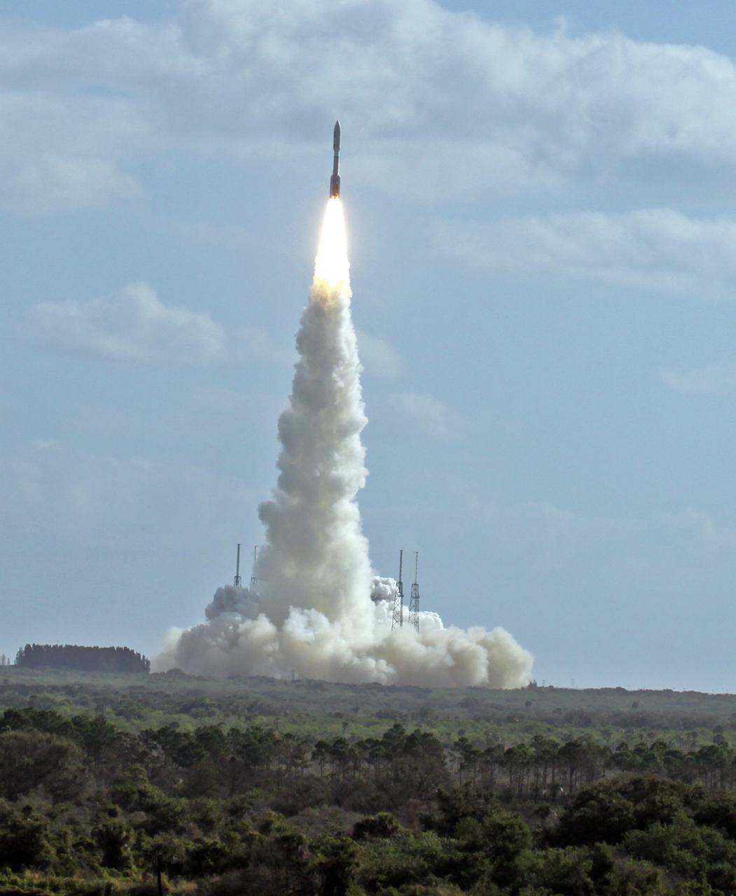 CAPE CANAVERAL, Fla. -- With NASA's Mars Science Laboratory (MSL) spacecraft sealed inside its payload fairing, the United Launch Alliance Atlas V rocket rides a pillar of smoke and flames as it lifts off from Space Launch Complex-41 on Cape Canaveral Air Force Station in Florida at 10:02 a.m. EST Nov. 26.      MSL's components include a car-sized rover, Curiosity, which has 10 science instruments designed to search for signs of life, including methane, and help determine if the gas is from a biological or geological source. For more information, visit http://www.nasa.gov/msl. Photo credit: NASA/Ken Thornsley
