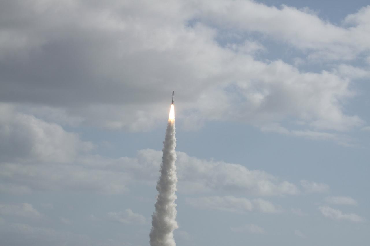 CAPE CANAVERAL, Fla. -- With NASA's Mars Science Laboratory (MSL) spacecraft sealed inside its payload fairing, the United Launch Alliance Atlas V rocket rides a tall pillar of smoke and flames as it soars over Space Launch Complex-41 on Cape Canaveral Air Force Station in Florida at 10:02 a.m. EST Nov. 26.        MSL's components include a car-sized rover, Curiosity, which has 10 science instruments designed to search for signs of life, including methane, and help determine if the gas is from a biological or geological source. For more information, visit http://www.nasa.gov/msl. Photo credit: NASA/Ken Thornsley