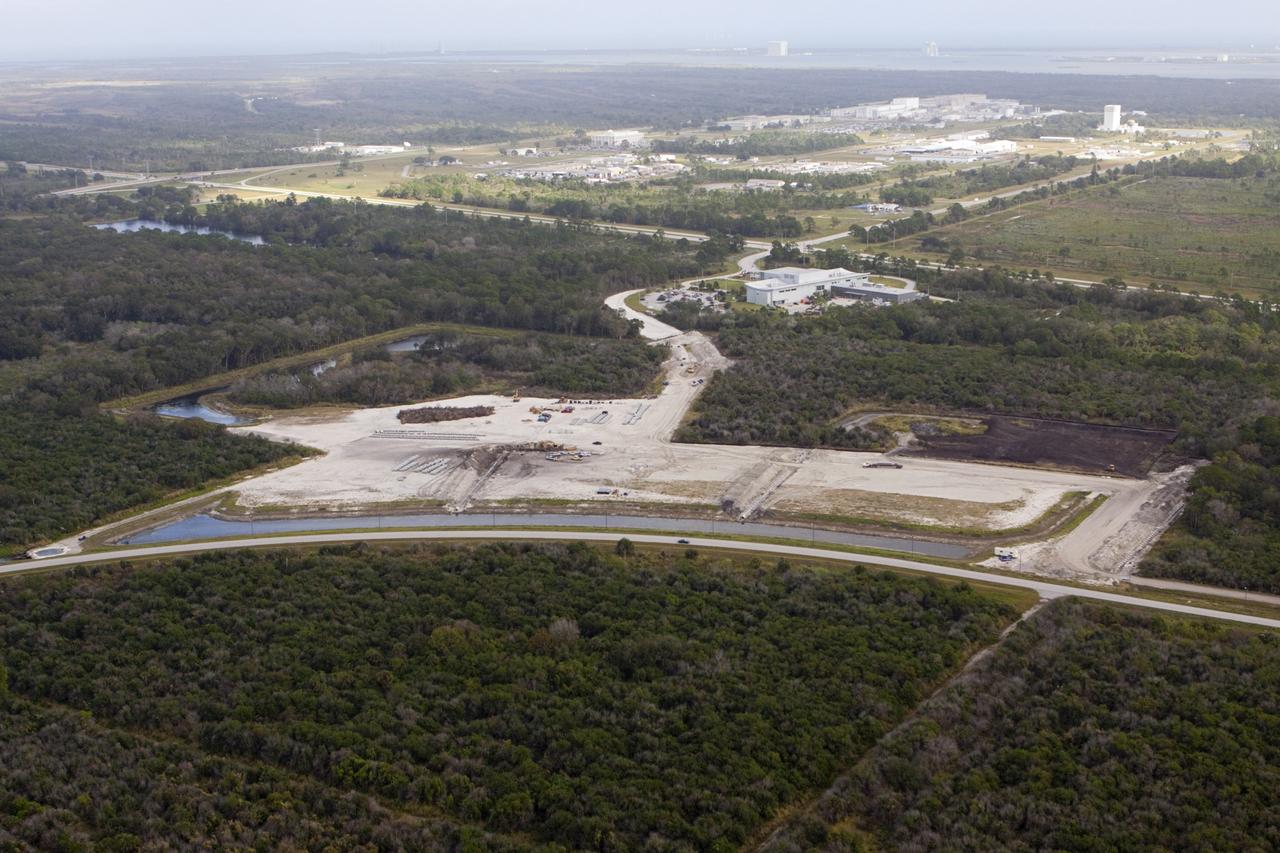 CAPE CANAVERAL, Fla. - The Exploration Park site near the Space Life Sciences Laboratory (SLSL) at NASA's Kennedy Space Center in Florida. The first phase will encompass 60 acres just outside Kennedy’s security gates. Nine buildings will provide 350,000-square feet of work space, including educational, office, research and lab, and high-bay facilities. Each building is expected to be certified in the U.S. Green Building Council’s Leadership in Environmental and Energy Design (LEED). Exploration Park is designed to be a strategically located complex, adjacent to the SLSL, for servicing diverse tenants and uses that will engage in activities to support space-related activities of NASA, other government agencies and the U.S. commercial space industry. The SLSL will be the anchor facility for the park. Photo credit: NASA/Kim Shiflett