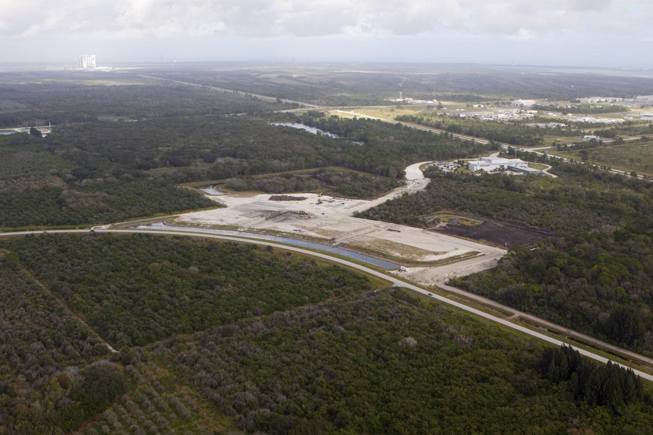 CAPE CANAVERAL, Fla. - The Exploration Park site near the Space Life Sciences Laboratory (SLSL) at NASA's Kennedy Space Center in Florida. The first phase will encompass 60 acres just outside Kennedy’s security gates. Nine buildings will provide 350,000-square feet of work space, including educational, office, research and lab, and high-bay facilities. Each building is expected to be certified in the U.S. Green Building Council’s Leadership in Environmental and Energy Design (LEED). Exploration Park is designed to be a strategically located complex, adjacent to the SLSL, for servicing diverse tenants and uses that will engage in activities to support space-related activities of NASA, other government agencies and the U.S. commercial space industry. The SLSL will be the anchor facility for the park. Photo credit: NASA/Kim Shiflett