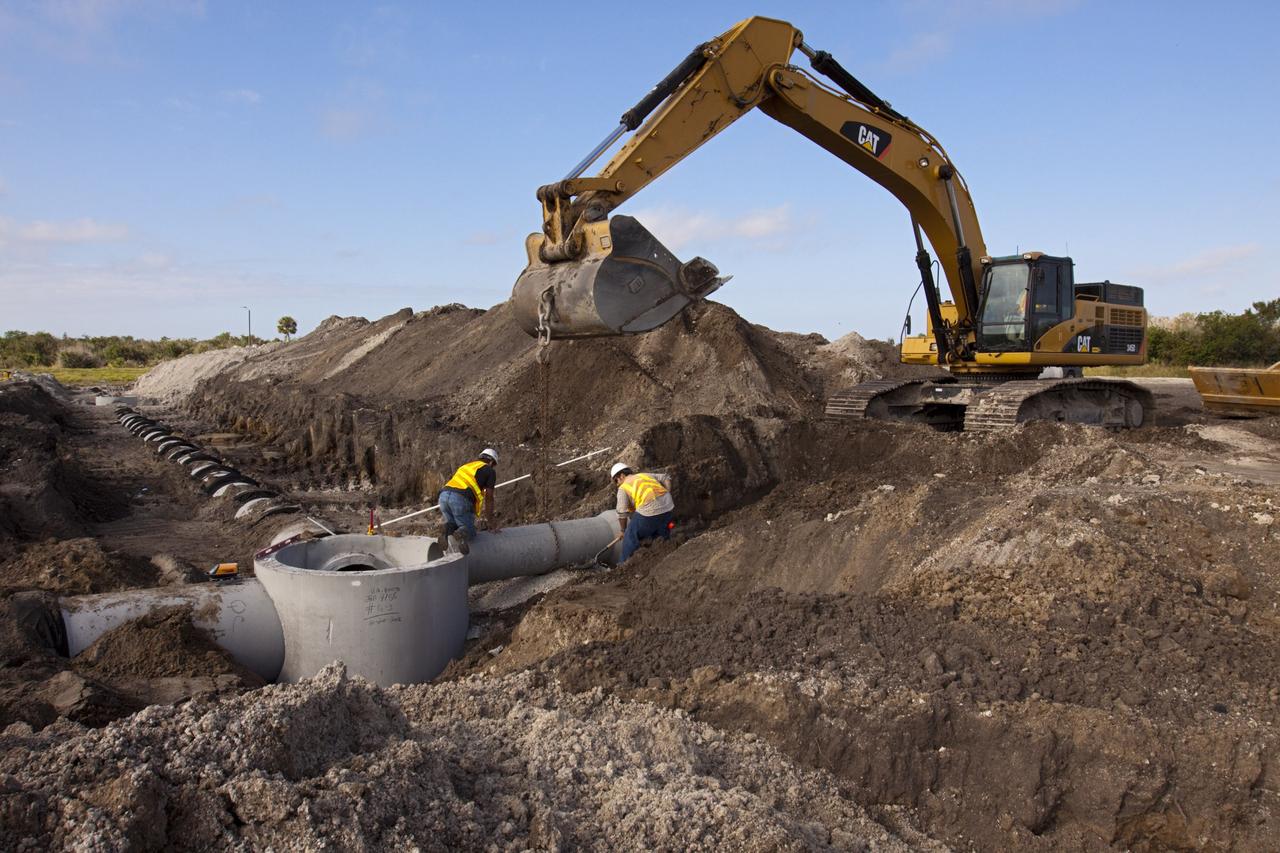 CAPE CANAVERAL, Fla. – Construction work progresses on Phase I of Exploration Park at NASA’s Kennedy Space Center in Florida.    Exploration Park is near the Space Life Sciences Laboratory (SLSL). The first phase encompasses 60 acres just outside Kennedy’s security gates. Nine buildings will provide 350,000-square feet of work space, including educational, office, research and lab, and high-bay facilities. Each building is expected to be certified in the U.S. Green Building Council’s Leadership in Environmental and Energy Design (LEED). Exploration Park is designed to be a strategically located complex, adjacent to the SLSL, for servicing diverse tenants and uses that will engage in activities to support space-related activities of NASA, other government agencies and the U.S. commercial space industry. The SLSL will be the anchor facility for the park. Photo credit: NASA/Kim Shiflett