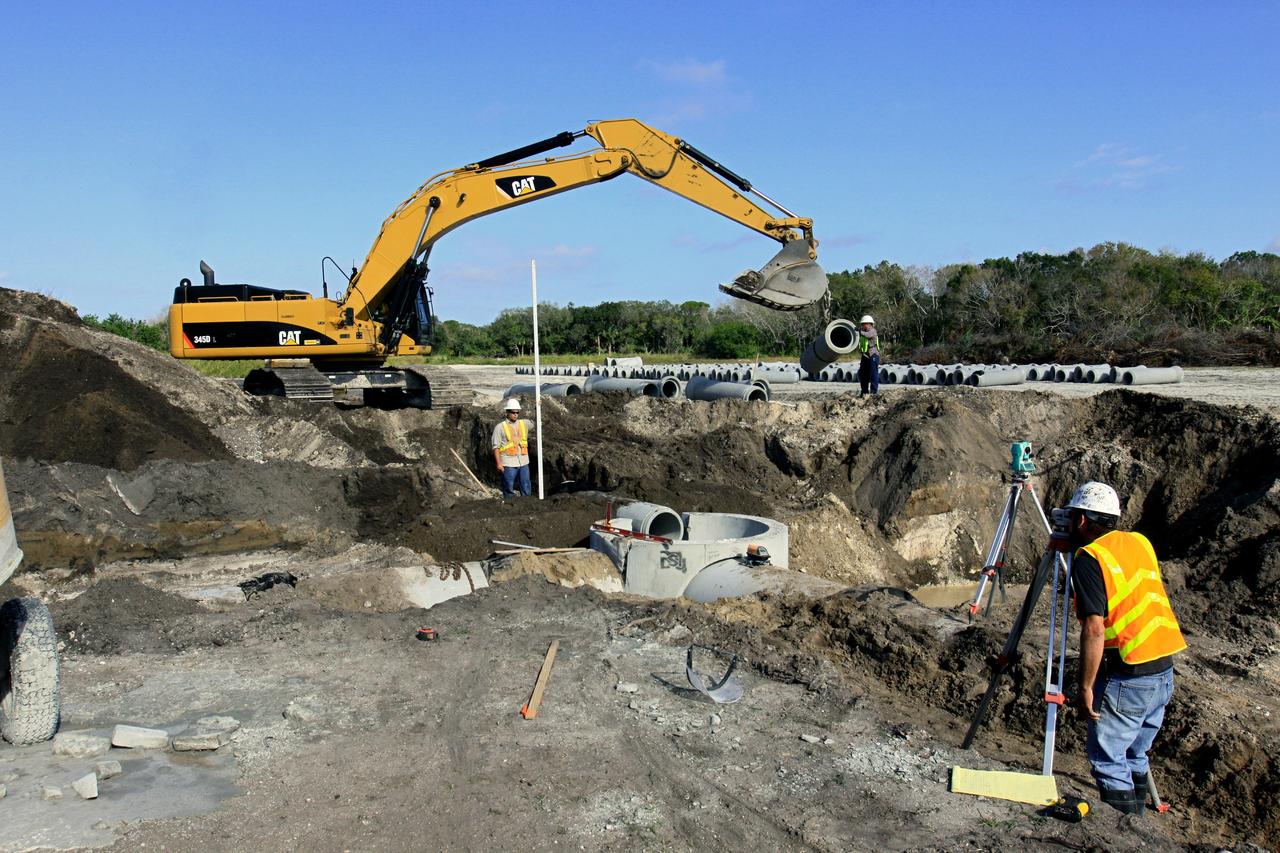 CAPE CANAVERAL, Fla. – Construction work progresses on Phase I of Exploration Park at NASA’s Kennedy Space Center in Florida.    Exploration Park is near the Space Life Sciences Laboratory (SLSL). The first phase encompasses 60 acres just outside Kennedy’s security gates. Nine buildings will provide 350,000-square feet of work space, including educational, office, research and lab, and high-bay facilities. Each building is expected to be certified in the U.S. Green Building Council’s Leadership in Environmental and Energy Design (LEED). Exploration Park is designed to be a strategically located complex, adjacent to the SLSL, for servicing diverse tenants and uses that will engage in activities to support space-related activities of NASA, other government agencies and the U.S. commercial space industry. The SLSL will be the anchor facility for the park. Photo credit: NASA/Kim Shiflett