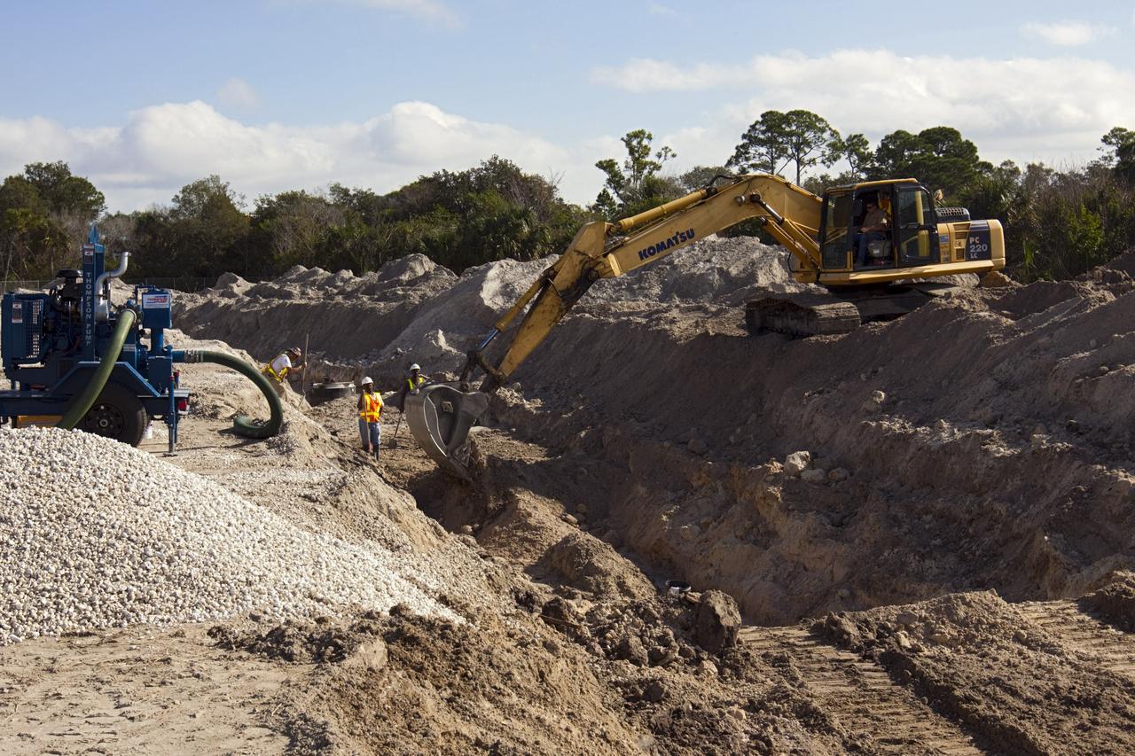 CAPE CANAVERAL, Fla. – Construction work progresses on Phase I of Exploration Park at NASA’s Kennedy Space Center in Florida.    Exploration Park is near the Space Life Sciences Laboratory (SLSL). The first phase encompasses 60 acres just outside Kennedy’s security gates. Nine buildings will provide 350,000-square feet of work space, including educational, office, research and lab, and high-bay facilities. Each building is expected to be certified in the U.S. Green Building Council’s Leadership in Environmental and Energy Design (LEED). Exploration Park is designed to be a strategically located complex, adjacent to the SLSL, for servicing diverse tenants and uses that will engage in activities to support space-related activities of NASA, other government agencies and the U.S. commercial space industry. The SLSL will be the anchor facility for the park. Photo credit: NASA/Kim Shiflett