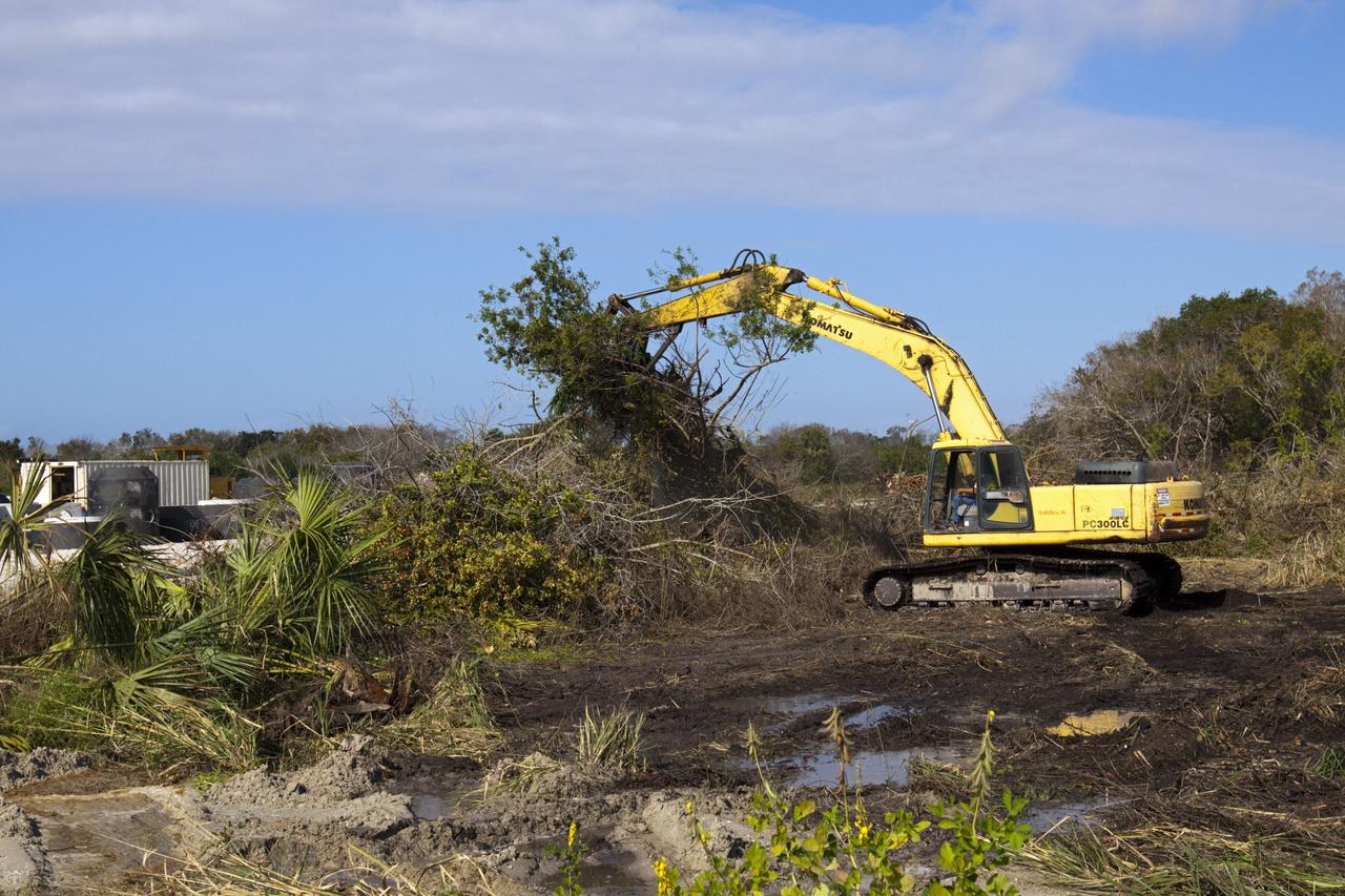 CAPE CANAVERAL, Fla. – Land is cleared as construction work progresses on Phase I of Exploration Park at NASA’s Kennedy Space Center in Florida.    Exploration Park is near the Space Life Sciences Laboratory (SLSL). The first phase encompasses 60 acres just outside Kennedy’s security gates. Nine buildings will provide 350,000-square feet of work space, including educational, office, research and lab, and high-bay facilities. Each building is expected to be certified in the U.S. Green Building Council’s Leadership in Environmental and Energy Design (LEED). Exploration Park is designed to be a strategically located complex, adjacent to the SLSL, for servicing diverse tenants and uses that will engage in activities to support space-related activities of NASA, other government agencies and the U.S. commercial space industry. The SLSL will be the anchor facility for the park. Photo credit: NASA/Kim Shiflett