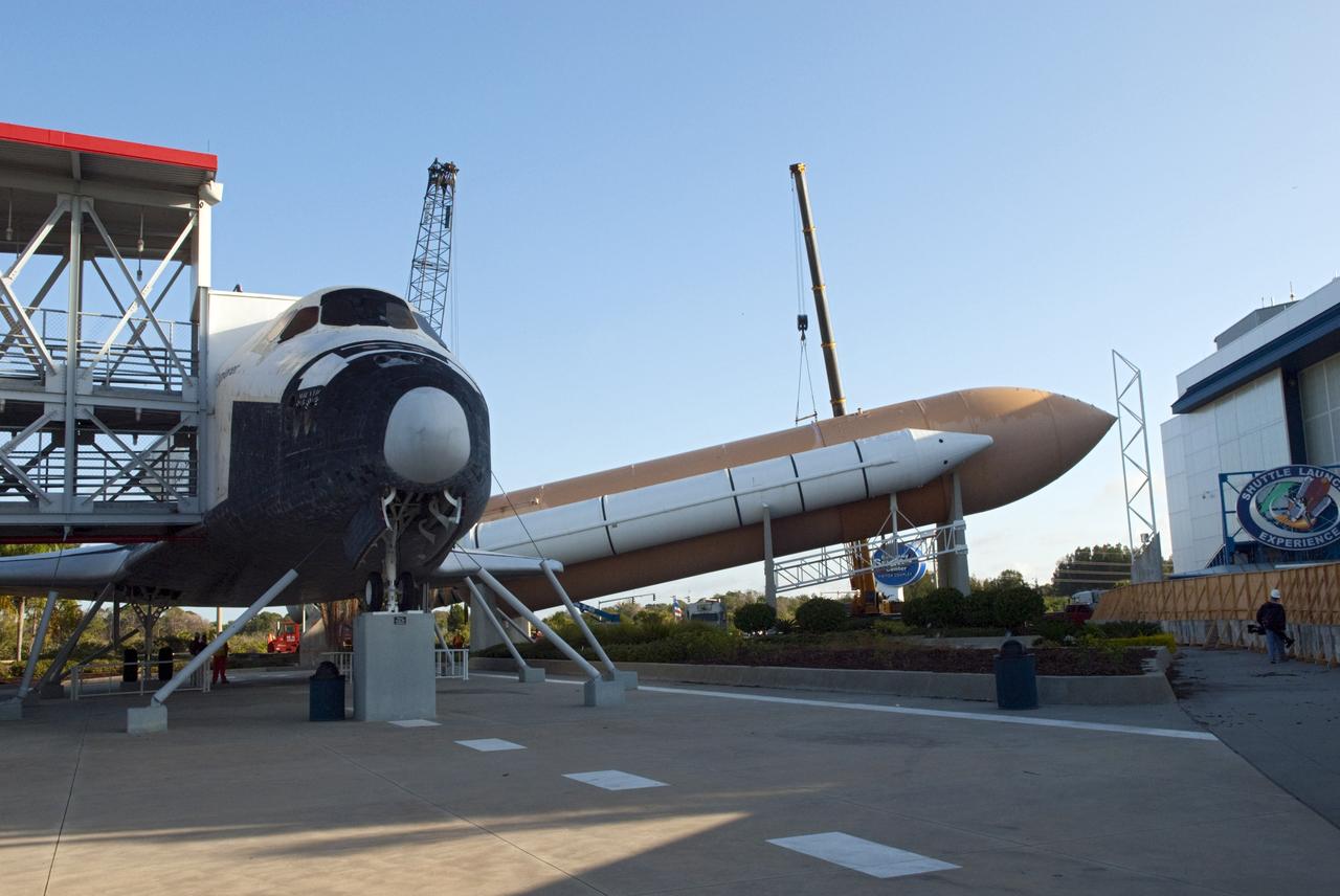 CAPE CANAVERAL, Fla. – Cranes remove a full-size, 149-foot-long, space shuttle solid rocket booster, or SRB, replica from the Kennedy Space Center Visitor Complex as the space-themed attraction makes way for a new exhibit featuring space shuttle Atlantis, which is currently undergoing preparations to go on public display. The SRB is being placed into temporary storage at NASA's Kennedy Space Center. The SRB was part of a mockup of the external tank and two SRBs at the visitor complex that were used to show visitors the size of actual space shuttle components. A space shuttle rode piggyback on the tank and boosters at liftoff and during the ascent into space. The SRBs burned out after about two-and-a-half minutes of flight. After recovery from the ocean, the boosters could be used repeatedly. Photo credit: NASA/Jim Grossmann