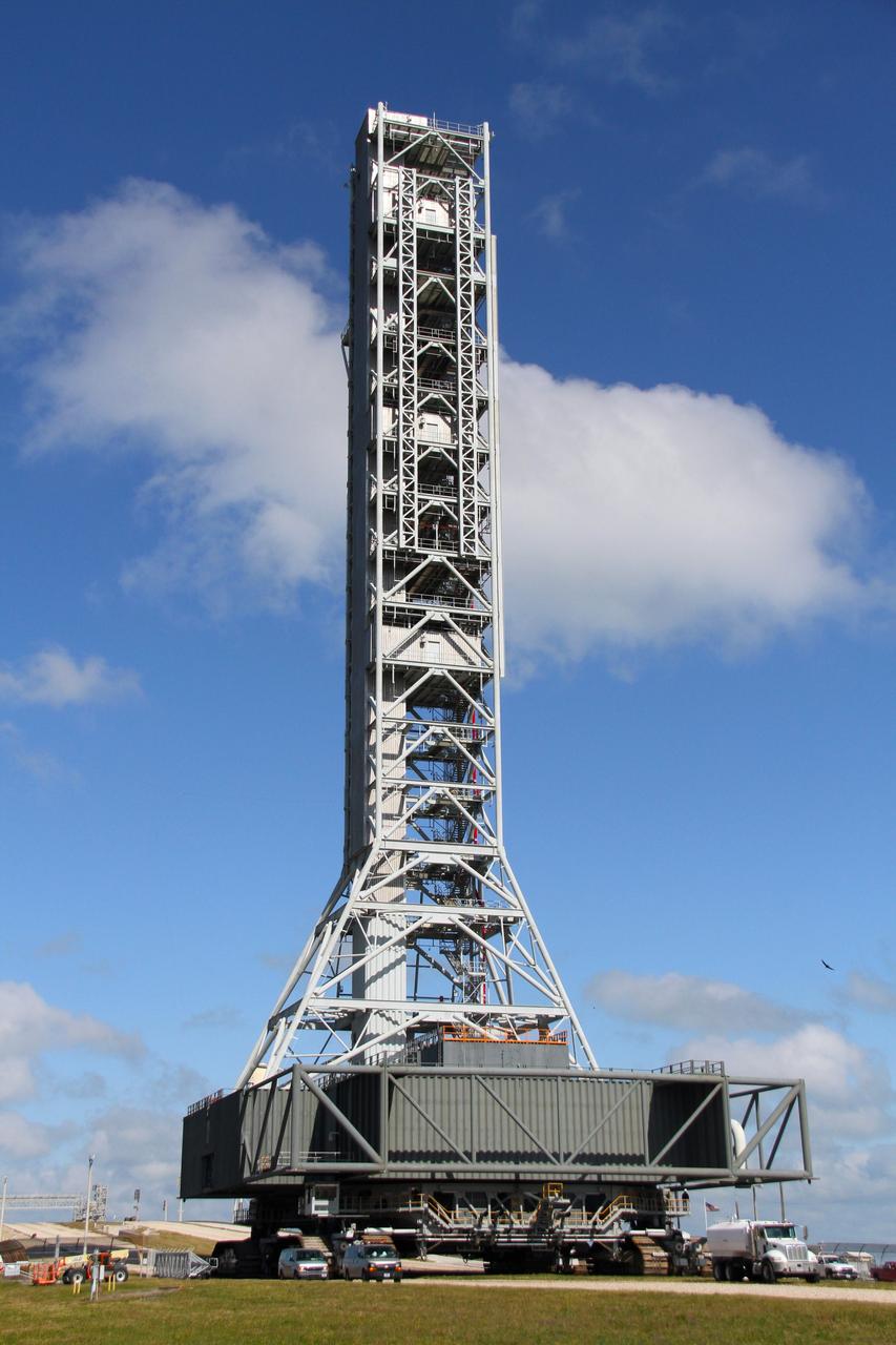 CAPE CANAVERAL, Fla. – The mobile launcher, or ML, reaches the base of Launch Pad 39B at NASA's Kennedy Space Center in Florida, on its 4.2-mile trek back to the park site near the Vehicle Assembly Building.     Data on the ML collected from structural and functional engineering tests during its two-week stay on the pad will be used in the next phases of construction. The 355-foot-tall ML structure, which took about two years to construct, will be modified by NASA’s 21st Century Ground Systems Program to support NASA’s Space Launch System, the heavy-lift rocket that will launch astronauts into deep space on future exploration missions. For more information, visit http://www.nasa.gov/exploration/systems/sls. Photo credit: NASA/Cory Huston