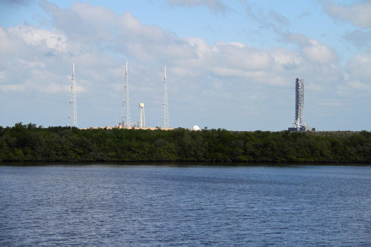 CAPE CANAVERAL, Fla. – The mobile launcher, or ML, is seen across the water near Launch Pad 39B at NASA's Kennedy Space Center in Florida, making the 4.2-mile trek back to the park site near the Vehicle Assembly Building.     Data on the ML collected from structural and functional engineering tests during its two-week stay on the pad will be used in the next phases of construction. The 355-foot-tall ML structure, which took about two years to construct, will be modified by NASA’s 21st Century Ground Systems Program to support NASA’s Space Launch System, the heavy-lift rocket that will launch astronauts into deep space on future exploration missions. For more information, visit http://www.nasa.gov/exploration/systems/sls. Photo credit: NASA/Cory Huston