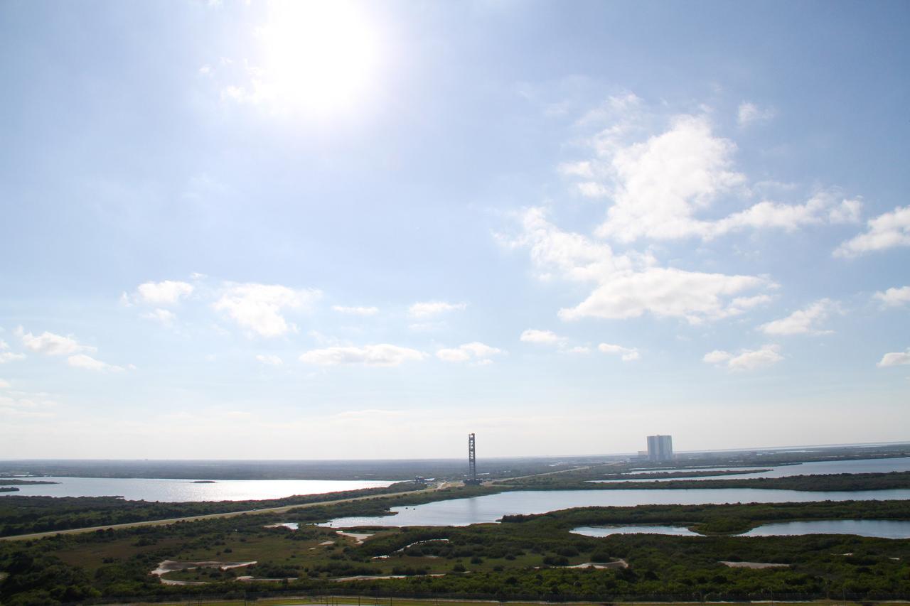 CAPE CANAVERAL, Fla. – The mobile launcher, or ML, traveling at about 1 mph atop a crawler-transporter, creeps from Launch Pad 39B to the park site near the Vehicle Assembly Building at NASA's Kennedy Space Center in Florida.    Data on the ML collected from structural and functional engineering tests during its two-week stay on the pad will be used in the next phases of construction. The 355-foot-tall ML structure, which took about two years to construct, will be modified by NASA’s 21st Century Ground Systems Program to support NASA’s Space Launch System, the heavy-lift rocket that will launch astronauts into deep space on future exploration missions. For more information, visit http://www.nasa.gov/exploration/systems/sls. Photo credit: NASA/Cory Huston