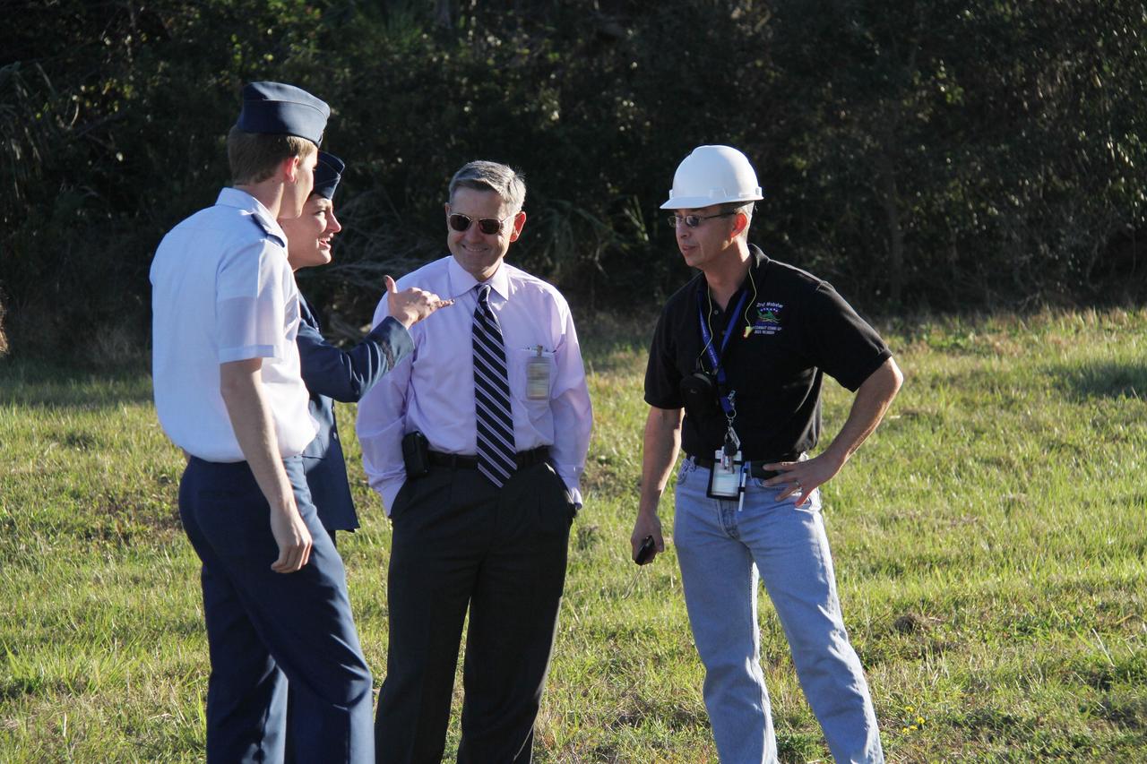 CAPE CANAVERAL, Fla. – Kennedy Space Center Director Robert Cabana (second from right) is on hand for the move of the mobile launcher, or ML, from Launch Pad 39B to the park site near the Vehicle Assembly Building at NASA's Kennedy Space Center in Florida.    Data on the ML collected from structural and functional engineering tests during its two-week stay on the pad will be used in the next phases of construction. The 355-foot-tall ML structure, which took about two years to construct, will be modified by NASA’s 21st Century Ground Systems Program to support NASA’s Space Launch System, the heavy-lift rocket that will launch astronauts into deep space on future exploration missions. For more information, visit http://www.nasa.gov/exploration/systems/sls. Photo credit: NASA/Cory Huston
