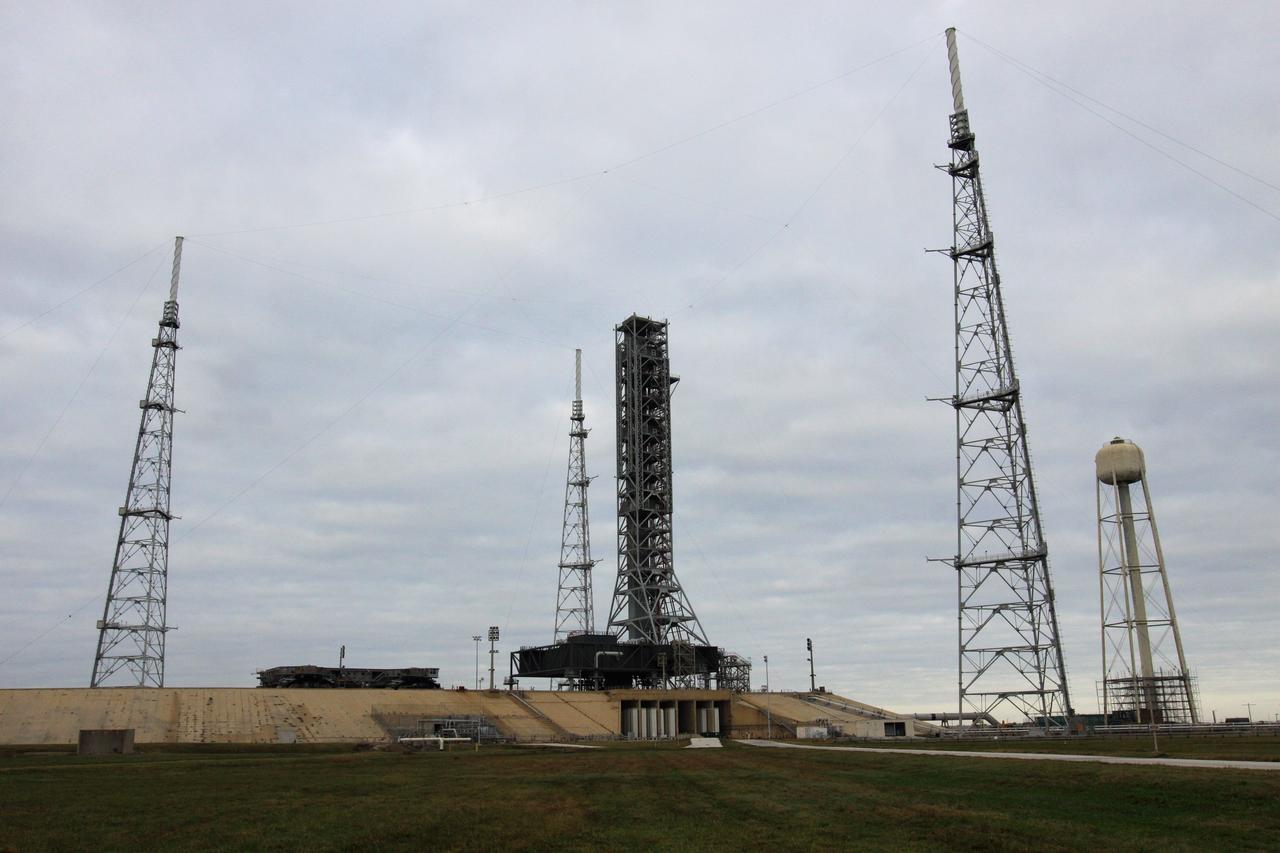 CAPE CANAVERAL, Fla. – At Launch Pad 39B at NASA's Kennedy Space Center in Florida, the crawler-transporter rolling toward the mobile launcher, or ML, will provide the ML a lift back to the park site near the Vehicle Assembly Building.    Data on the ML collected from structural and functional engineering tests during its two-week stay on the pad will be used in the next phases of construction. The 355-foot-tall ML structure, which took about two years to construct, will be modified by NASA’s 21st Century Ground Systems Program to support NASA’s Space Launch System, the heavy-lift rocket that will launch astronauts into deep space on future exploration missions. For more information, visit http://www.nasa.gov/exploration/systems/sls. Photo credit: NASA/Kim Shiflett