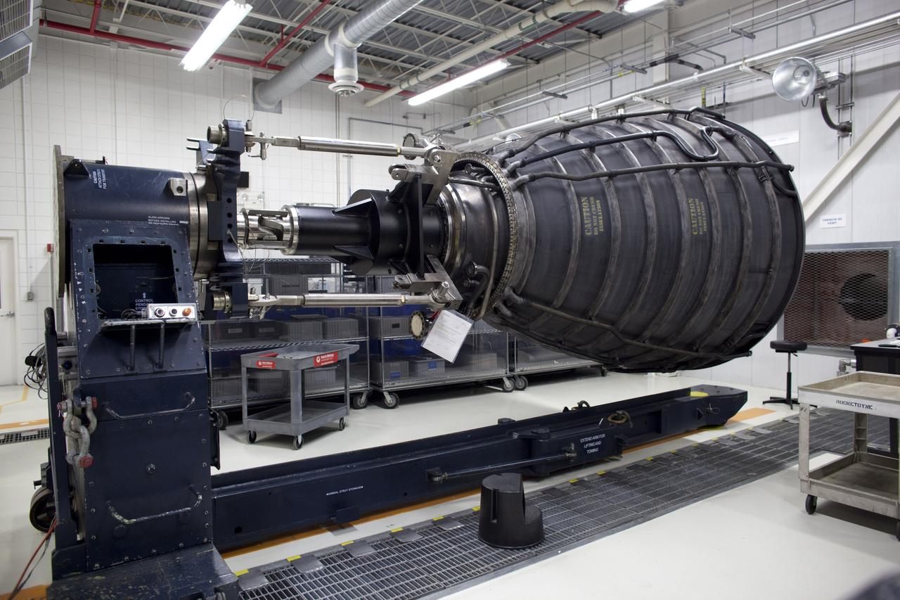 CAPE CANAVERAL, Fla. -- Inside the Pratt & Whitney Rocketdyne engine shop at NASA’s Kennedy Space Center in Florida, one of the three replica shuttle main engines (RSMEs) created for space shuttle Discovery is attached to the space shuttle main engine horizontal installer.    The replica engines will be transported from the engine shop to the processing facility for installation on Discovery in January 2012. The work is part of the Space Shuttle Program’s transition and retirement processing of shuttle Discovery. Discovery is being prepared for display at the Smithsonian’s National Air and Space Museum, Steven F. Udvar-Hazy Center in Chantilly, Va. For more information, visit http://www.nasa.gov/shuttle.  Photo credit: NASA/Dimitri Gerondidakis
