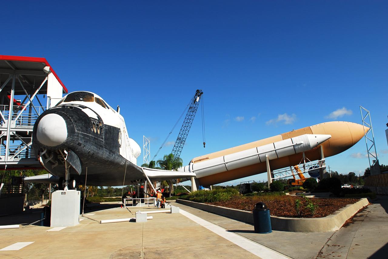 CAPE CANAVERAL, Fla. – Cranes remove a full-size, 149-foot-long, space shuttle solid rocket booster, or SRB, replica from the Kennedy Space Center Visitor Complex as the space-themed attraction makes way for a new exhibit featuring space shuttle Atlantis, which is currently undergoing preparations to go on public display. The SRB is being placed into temporary storage at NASA's Kennedy Space Center. The SRB was part of a mockup of the external tank and two SRBs at the visitor complex that were used to show visitors the size of actual space shuttle components. A space shuttle rode piggyback on the tank and boosters at liftoff and during the ascent into space. The SRBs burned out after about two-and-a-half minutes of flight. After recovery from the ocean, the boosters could be used repeatedly. Photo credit: NASA/Jim Grossman