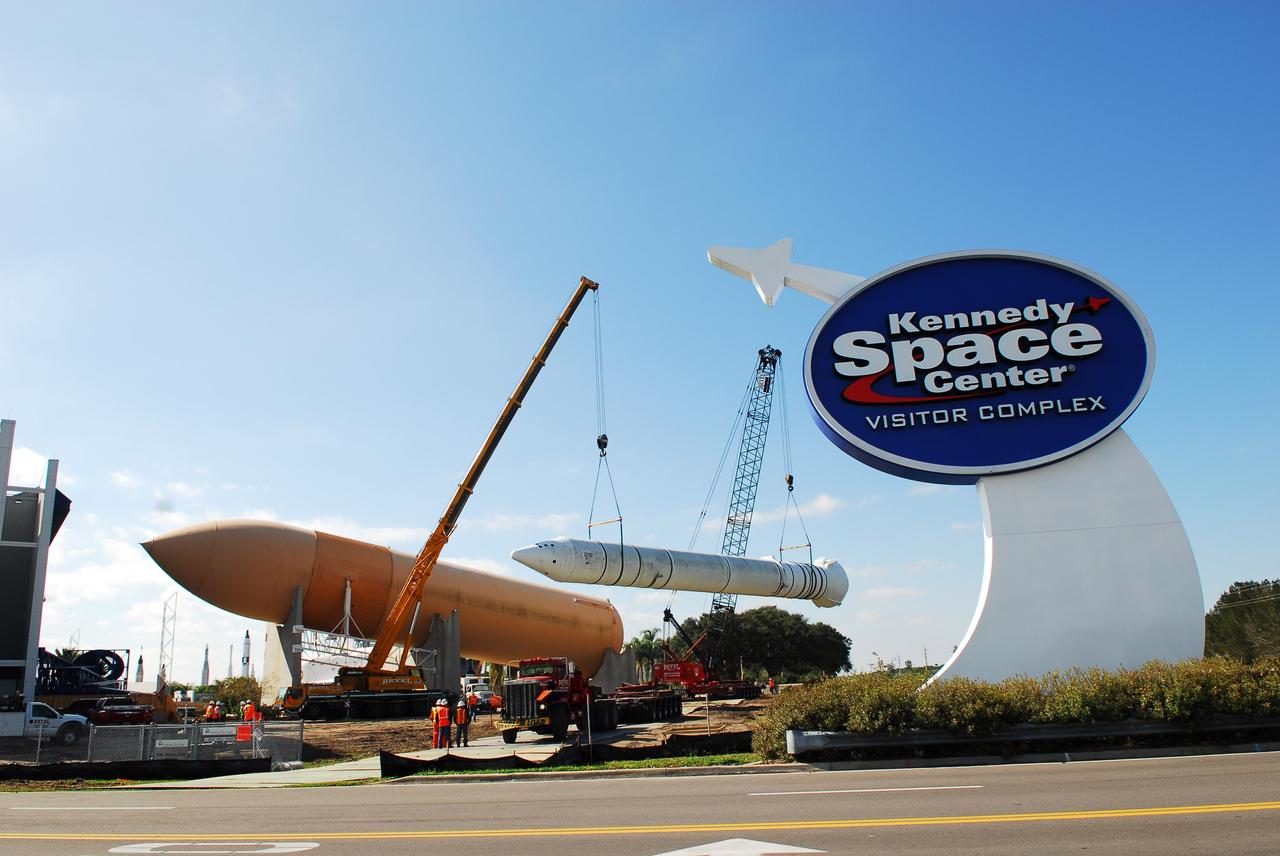 CAPE CANAVERAL, Fla. – Cranes remove a full-size, 149-foot-long, space shuttle solid rocket booster, or SRB, replica from the Kennedy Space Center Visitor Complex as the space-themed attraction makes way for a new exhibit featuring space shuttle Atlantis, which is currently undergoing preparations to go on public display. The SRB is being placed into temporary storage at NASA's Kennedy Space Center. The SRB was part of a mockup of the external tank and two SRBs at the visitor complex that were used to show visitors the size of actual space shuttle components. A space shuttle rode piggyback on the tank and boosters at liftoff and during the ascent into space. The SRBs burned out after about two-and-a-half minutes of flight. After recovery from the ocean, the boosters could be used repeatedly. Photo credit: NASA/Jim Grossman