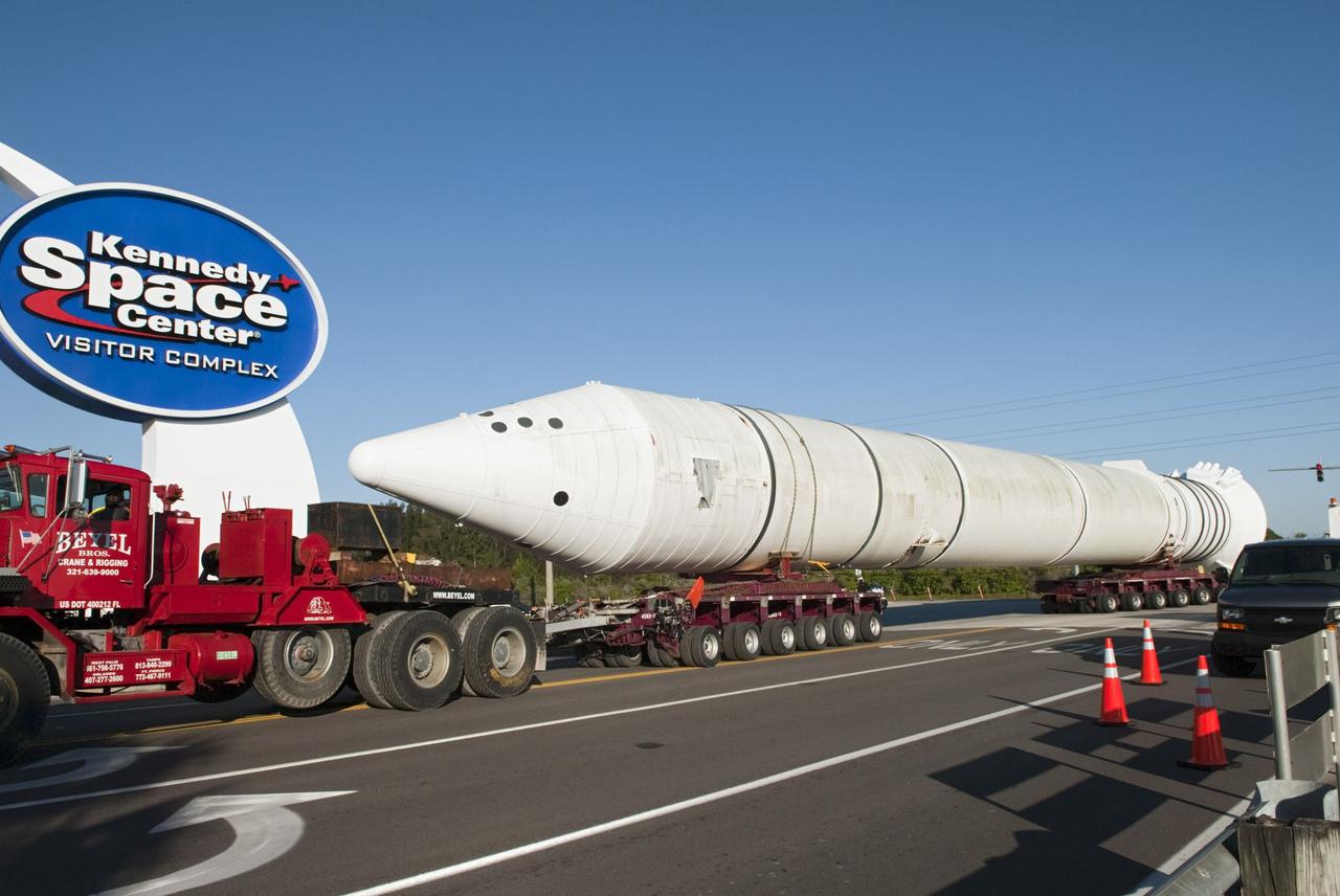 CAPE CANAVERAL, Fla. – A truck hauls a full-size, 149-foot-long, space shuttle solid rocket booster, or SRB, replica from the Kennedy Space Center Visitor Complex as the space-themed attraction makes way for a new exhibit featuring space shuttle Atlantis, which is currently undergoing preparations to go on public display. The SRB is being placed into temporary storage at NASA's Kennedy Space Center. The SRB was part of a mockup of the external tank and two SRBs at the visitor complex that were used to show visitors the size of actual space shuttle components. A space shuttle rode piggyback on the tank and boosters at liftoff and during the ascent into space. The SRBs burned out after about two-and-a-half minutes of flight. After recovery from the ocean, the boosters could be used repeatedly. Photo credit: NASA/Jim Grossman