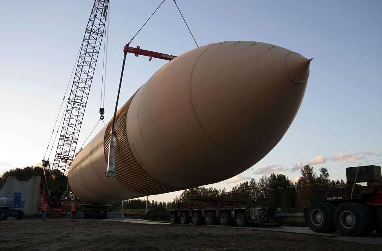 CAPE CANAVERAL, Fla. – Cranes remove a full-size replica of a space shuttle external fuel tank from the Kennedy Space Center Visitor Complex as the space-themed attraction makes way for a new exhibit featuring space shuttle Atlantis, which is currently undergoing preparations to go on public display. The tank is being placed into temporary storage at NASA's Kennedy Space Center. The tank was part of a mockup of the external tank and two solid rocket boosters at the visitor complex that were used to show visitors the size of actual space shuttle components. A space shuttle rode piggyback on the tank and boosters at liftoff and during the ascent into space. The tank, which held propellants for the shuttle's three main engines, was not reused, but burned up in the atmosphere and fell into the ocean. Photo credit: NASA/Jim Grossman