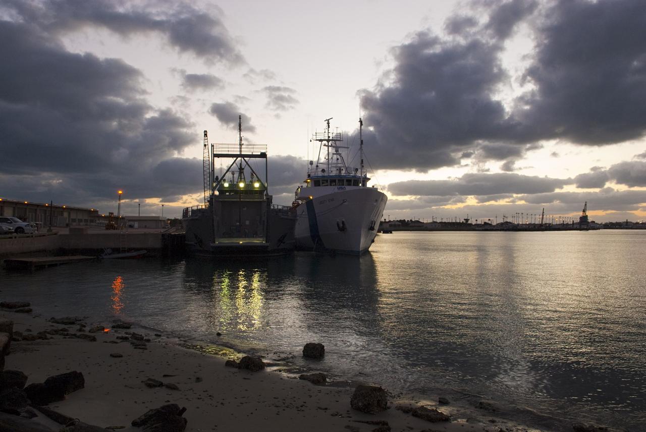 CAPE CANAVERAL, Fla. – Dawn at Port Canaveral in Florida finds preparations under way for the departure of NASA's Liberty Star ship. Liberty Star has been enlisted to support the Crew Module Recovery Attach Fitting Test (CRAFT) which began at-sea operations Nov. 29. Multiple attach clips are being evaluated against the current recovery cleat configuration by U.S. Air Force pararescue jumpers (PJs) and a U.S. Navy diver. The 21st Century Ground Systems Program will use data collected from the tests to help develop ground operations support equipment that could be used to recover an uncrewed Orion flight test capsule after splashdown. The Orion Multi-Purpose Crew Vehicle is NASA's next-generation spacecraft being developed for deep space missions to asteroids, moons and other interplanetary destinations throughout the solar system. For more information, visit http://www.nasa.gov/orion. Photo credit: NASA/Tim Jacobs