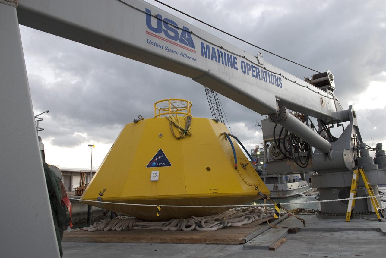 CAPE CANAVERAL, Fla. – At Port Canaveral in Florida, an Orion flight test capsule is secured to the deck of NASA's Liberty Star ship. Liberty Star has been enlisted to support the Crew Module Recovery Attach Fitting Test (CRAFT) which began at-sea operations Nov. 29. Multiple attach clips are being evaluated against the current recovery cleat configuration by U.S. Air Force pararescue jumpers (PJs) and a U.S. Navy diver. The 21st Century Ground Systems Program will use data collected from the tests to help develop ground operations support equipment that could be used to recover an uncrewed Orion flight test capsule after splashdown. The Orion Multi-Purpose Crew Vehicle is NASA's next-generation spacecraft being developed for deep space missions to asteroids, moons and other interplanetary destinations throughout the solar system. For more information, visit http://www.nasa.gov/orion. Photo credit: NASA/Tim Jacobs
