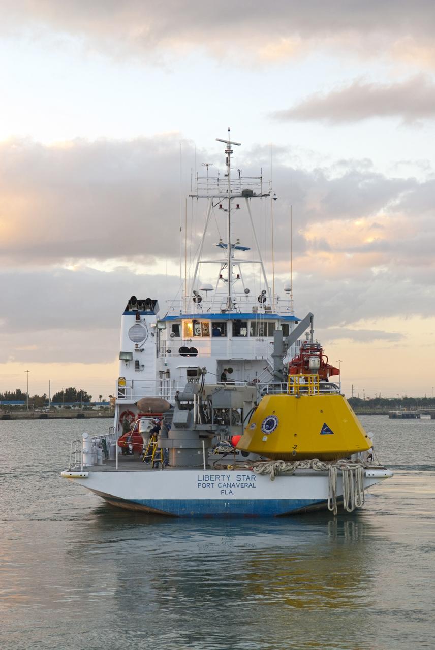CAPE CANAVERAL, Fla. – NASA's Liberty Star ship departs Port Canaveral in Florida with an Orion flight test capsule secured to its deck. Liberty Star has been enlisted to support the Crew Module Recovery Attach Fitting Test (CRAFT) which began at-sea operations Nov. 29. Multiple attach clips are being evaluated against the current recovery cleat configuration by U.S. Air Force pararescue jumpers (PJs) and a U.S. Navy diver. The 21st Century Ground Systems Program will use data collected from the tests to help develop ground operations support equipment that could be used to recover an uncrewed Orion flight test capsule after splashdown. The Orion Multi-Purpose Crew Vehicle is NASA's next-generation spacecraft being developed for deep space missions to asteroids, moons and other interplanetary destinations throughout the solar system. For more information, visit http://www.nasa.gov/orion. Photo credit: NASA/Tim Jacobs