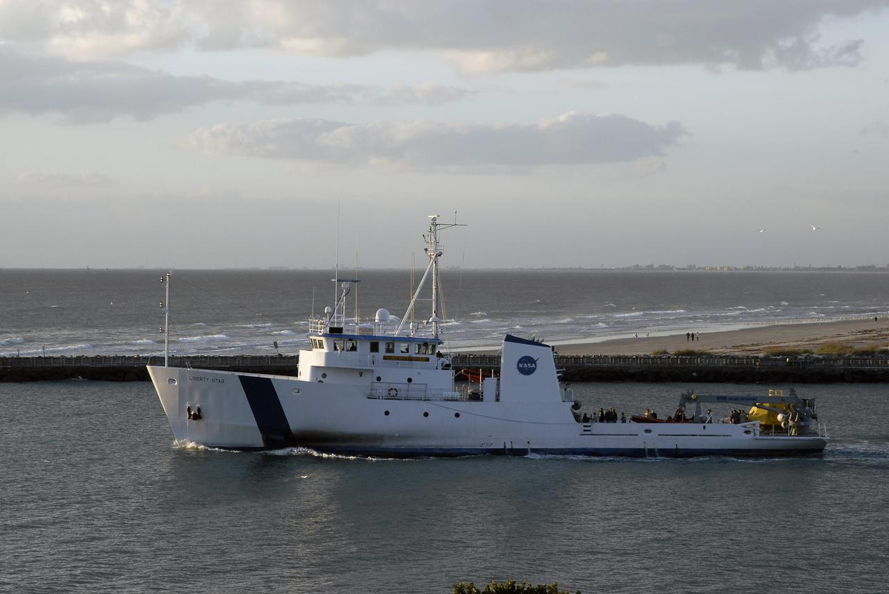 CAPE CANAVERAL, Fla. – At Port Canaveral in Florida, NASA's Liberty Star ship, with an Orion flight test capsule secured to its deck, passes the jetties as it heads toward the Atlantic Ocean. Liberty Star has been enlisted to support the Crew Module Recovery Attach Fitting Test (CRAFT) which began at-sea operations Nov. 29. Multiple attach clips are being evaluated against the current recovery cleat configuration by U.S. Air Force pararescue jumpers (PJs) and a U.S. Navy diver. The 21st Century Ground Systems Program will use data collected from the tests to help develop ground operations support equipment that could be used to recover an uncrewed Orion flight test capsule after splashdown. The Orion Multi-Purpose Crew Vehicle is NASA's next-generation spacecraft being developed for deep space missions to asteroids, moons and other interplanetary destinations throughout the solar system. For more information, visit http://www.nasa.gov/orion. Photo credit: NASA/Tim Jacobs