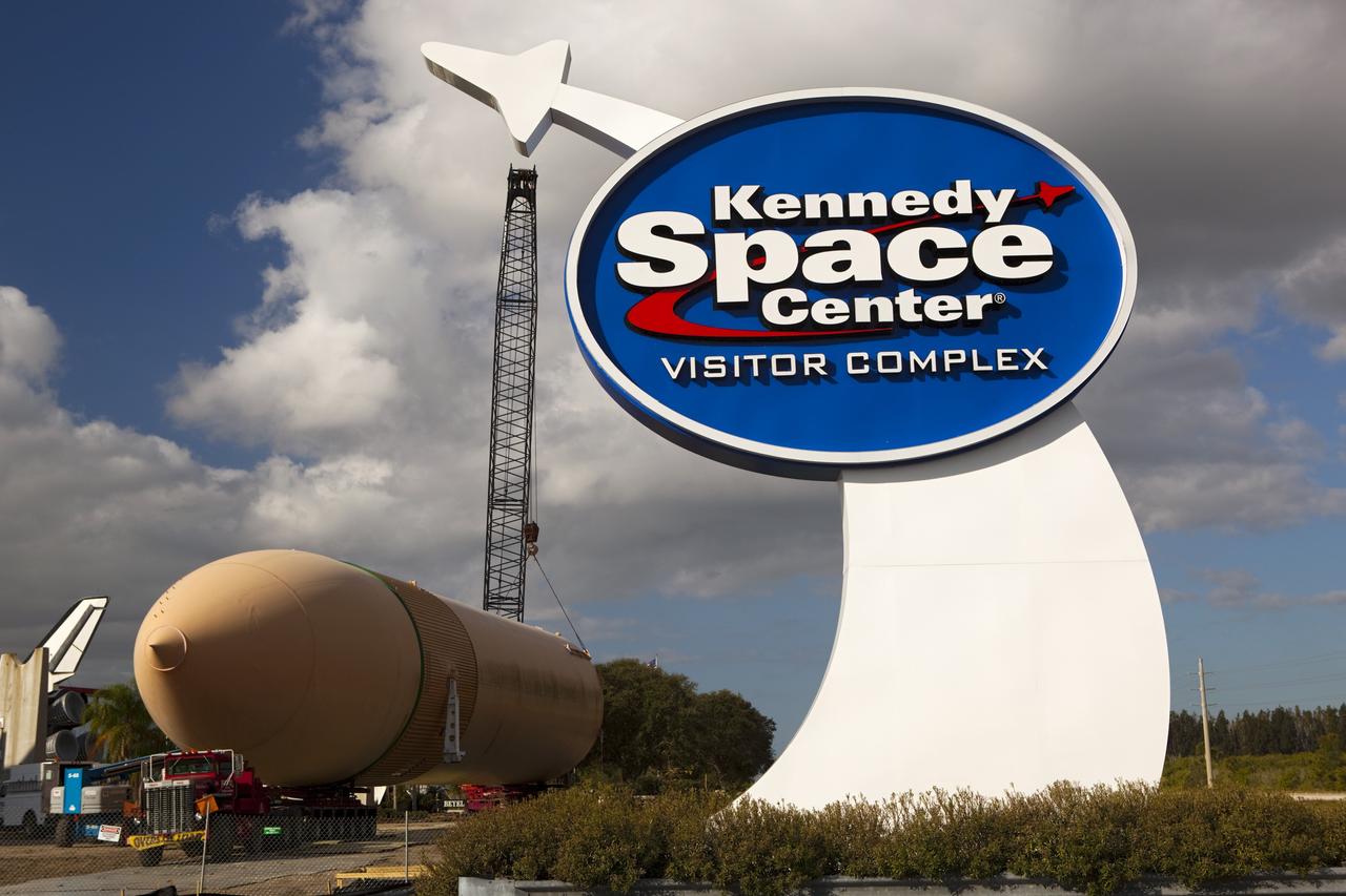 CAPE CANAVERAL, Fla. – A crane positions a full-size display of a space shuttle external fuel tank onto a truck to move it from the Kennedy Space Center Visitor Complex as the space-themed attraction makes way for a new exhibit featuring space shuttle Atlantis, which is currently undergoing preparations to go on public display. The tank is being placed into temporary storage at NASA's Kennedy Space Center. The tank was part of a display of the external tank and two solid rocket boosters at the visitor complex that were used to show visitors the size of actual space shuttle components. A space shuttle rode piggyback on the tank and boosters at liftoff and during the ascent into space. The tank, which held propellants for the shuttle's three main engines, was not reused, but burned up in the atmosphere and fell into the ocean. Photo credit: NASA/Dmitri Gerondidakis