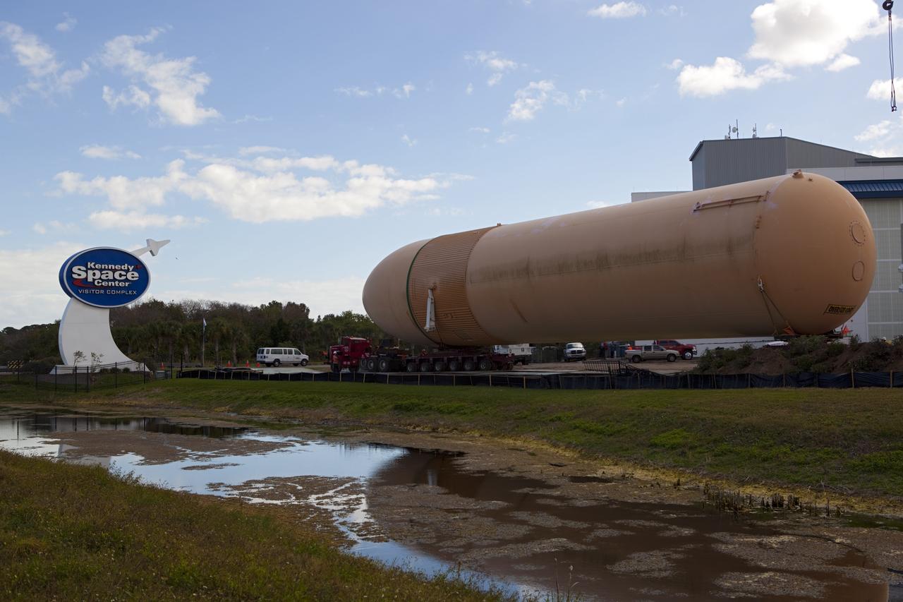CAPE CANAVERAL, Fla. – A truck hauls a full-size display of a space shuttle external fuel tank from the Kennedy Space Center Visitor Complex as the space-themed attraction makes way for a new exhibit featuring space shuttle Atlantis, which is currently undergoing preparations to go on public display. The tank is being placed into temporary storage at NASA's Kennedy Space Center. The tank was part of a display of the external tank and two solid rocket boosters at the visitor complex that were used to show visitors the size of actual space shuttle components. A space shuttle rode piggyback on the tank and boosters at liftoff and during the ascent into space. The tank, which held propellants for the shuttle's three main engines, was not reused, but burned up in the atmosphere and fell into the ocean. Photo credit: NASA/Dmitri Gerondidakis