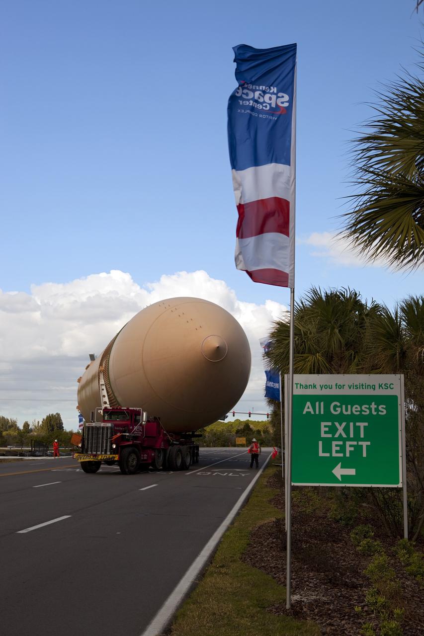 CAPE CANAVERAL, Fla. – A truck hauls a full-size display of a space shuttle external fuel tank from the Kennedy Space Center Visitor Complex as the space-themed attraction makes way for a new exhibit featuring space shuttle Atlantis, which is currently undergoing preparations to go on public display. The tank is being placed into temporary storage at NASA's Kennedy Space Center. The tank was part of a display of the external tank and two solid rocket boosters at the visitor complex that were used to show visitors the size of actual space shuttle components. A space shuttle rode piggyback on the tank and boosters at liftoff and during the ascent into space. The tank, which held propellants for the shuttle's three main engines, was not reused, but burned up in the atmosphere and fell into the ocean. Photo credit: NASA/Dmitri Gerondidakis