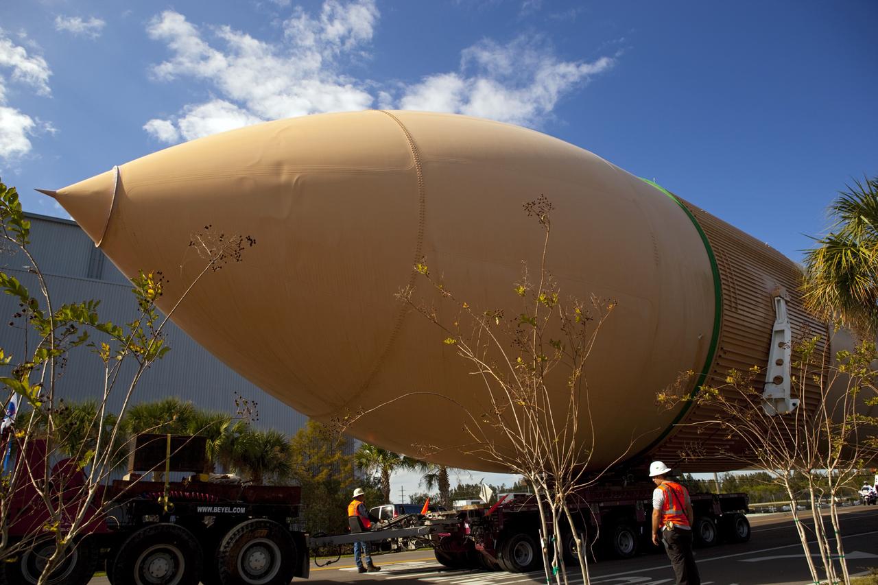 CAPE CANAVERAL, Fla. – A truck hauls a full-size display of a space shuttle external fuel tank from the Kennedy Space Center Visitor Complex as the space-themed attraction makes way for a new exhibit featuring space shuttle Atlantis, which is currently undergoing preparations to go on public display. The tank is being placed into temporary storage at NASA's Kennedy Space Center. The tank was part of a display of the external tank and two solid rocket boosters at the visitor complex that were used to show visitors the size of actual space shuttle components. A space shuttle rode piggyback on the tank and boosters at liftoff and during the ascent into space. The tank, which held propellants for the shuttle's three main engines, was not reused, but burned up in the atmosphere and fell into the ocean. Photo credit: NASA/Dmitri Gerondidakis