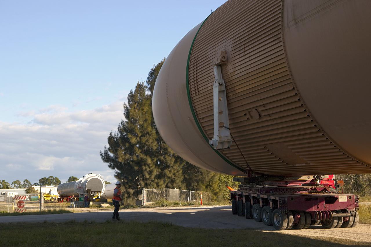 CAPE CANAVERAL, Fla. – A truck hauls a full-size display of a space shuttle external fuel tank from the Kennedy Space Center Visitor Complex as the space-themed attraction makes way for a new exhibit featuring space shuttle Atlantis, which is currently undergoing preparations to go on public display. The tank is being placed into temporary storage at NASA's Kennedy Space Center. The tank was part of a display of the external tank and two solid rocket boosters at the visitor complex that were used to show visitors the size of actual space shuttle components. A space shuttle rode piggyback on the tank and boosters at liftoff and during the ascent into space. The tank, which held propellants for the shuttle's three main engines, was not reused, but burned up in the atmosphere and fell into the ocean. Photo credit: NASA/Dmitri Gerondidakis