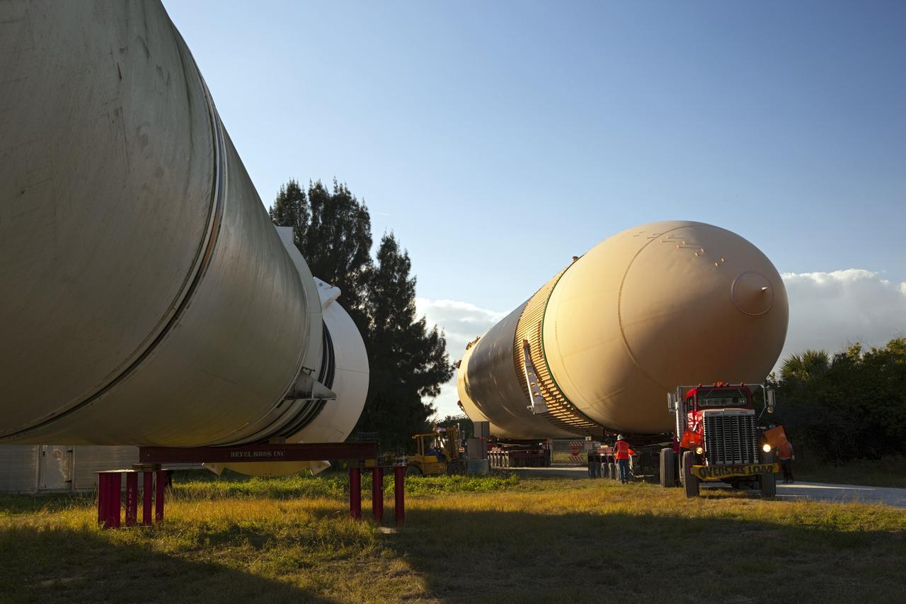 CAPE CANAVERAL, Fla. – A truck hauls a full-size display of a space shuttle external fuel tank from the Kennedy Space Center Visitor Complex as the space-themed attraction makes way for a new exhibit featuring space shuttle Atlantis, which is currently undergoing preparations to go on public display. The tank is being placed into temporary storage at NASA's Kennedy Space Center. The tank was part of a display of the external tank and two solid rocket boosters at the visitor complex that were used to show visitors the size of actual space shuttle components. A space shuttle rode piggyback on the tank and boosters at liftoff and during the ascent into space. The tank, which held propellants for the shuttle's three main engines, was not reused, but burned up in the atmosphere and fell into the ocean. Photo credit: NASA/Dmitri Gerondidakis