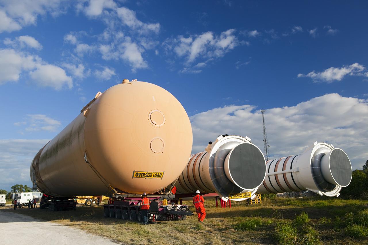 CAPE CANAVERAL, Fla. – A truck positions a full-size display of a space shuttle external fuel tank from the Kennedy Space Center Visitor Complex at a temporary storage area at NASA's Kennedy Space Center. The tank was part of a display of the external tank and two solid rocket boosters at the visitor complex that were used to show visitors the size of actual space shuttle components. A space shuttle rode piggyback on the tank and boosters at liftoff and during the ascent into space. The tank, which held propellants for the shuttle's three main engines, was not reused, but burned up in the atmosphere and fell into the ocean. Photo credit: NASA/Dmitri Gerondidakis