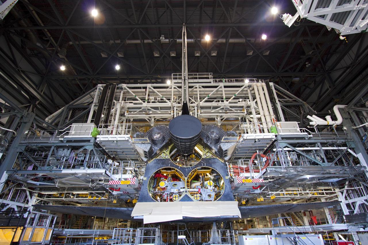 CAPE CANAVERAL, Fla. – Inside Orbiter Processing Facility-1 at NASA's Kennedy Space Center in Florida, a replica shuttle main engine (RSME) has been installed on space shuttle Discovery.    This is the first of three replica engines to be installed. The work is part of the Space Shuttle Program’s transition and retirement processing of Discovery. Discovery is being prepared for display at the Smithsonian’s National Air and Space Museum, Steven F. Udvar-Hazy Center in Chantilly, Va. For more information, visit http://www.nasa.gov/shuttle.  Photo credit: NASA/Jim Grossmann