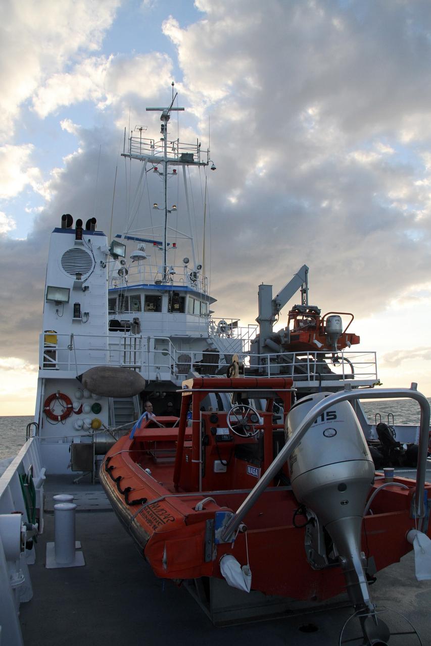 CAPE CANAVERAL, Fla. – NASA's Liberty Star ship heads into the Atlantic Ocean where tests will be performed on an Orion flight test capsule.    The Crew Module Recovery Attach Fitting Test (CRAFT) on the capsule, which began at-sea operations Nov. 29, is under way.  Multiple attach clips are being evaluated against the current recovery cleat configuration by U.S. Air Force pararescue jumpers (PJs) and a U.S. Navy diver. The 21st Century Ground Systems Program will use data collected from the tests to help develop ground operations support equipment that could be used to recover an uncrewed Orion flight test capsule after splashdown. The Orion Multi-Purpose Crew Vehicle is NASA's next-generation spacecraft being developed for deep space missions to asteroids, moons and other interplanetary destinations throughout the solar system. For more information, visit http://www.nasa.gov/orion. Photo credit: NASA/Cory Huston