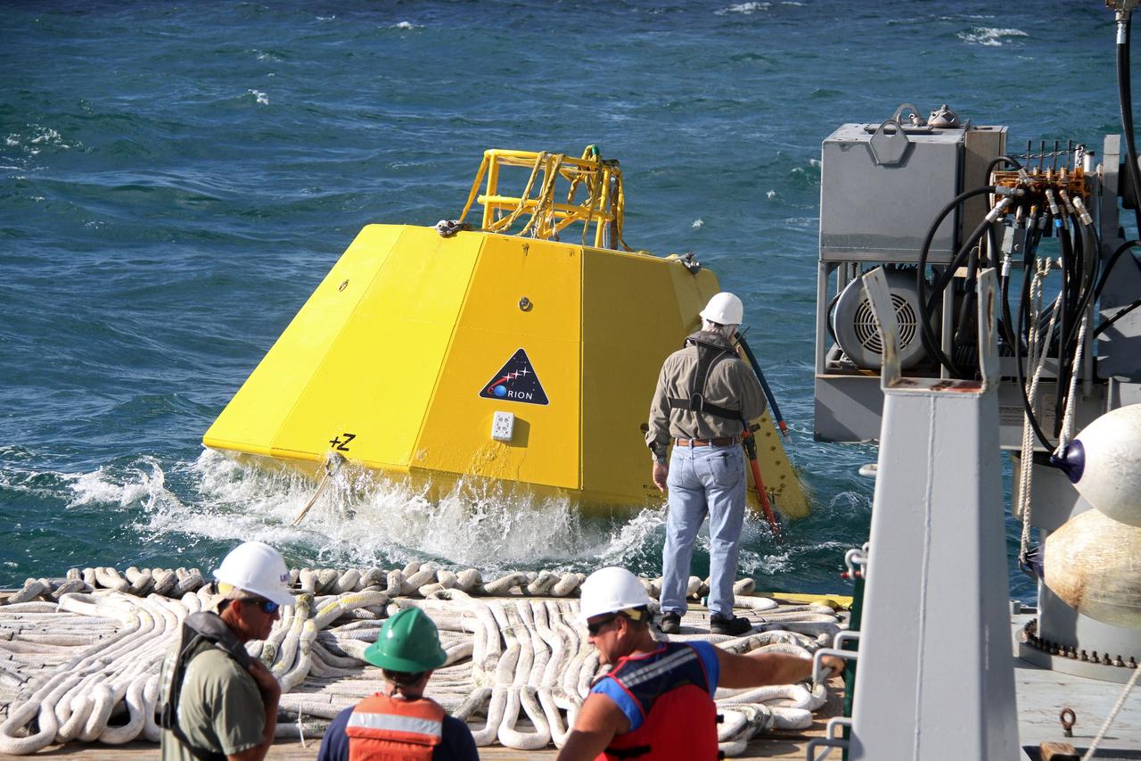 CAPE CANAVERAL, Fla. – An Orion flight test capsule makes a splash into the Atlantic Ocean as it slides from the deck of NASA's Liberty Star ship into the water.    The Crew Module Recovery Attach Fitting Test (CRAFT) on the capsule, which began at-sea operations Nov. 29, is under way.  Multiple attach clips are being evaluated against the current recovery cleat configuration by U.S. Air Force pararescue jumpers (PJs) and a U.S. Navy diver. The 21st Century Ground Systems Program will use data collected from the tests to help develop ground operations support equipment that could be used to recover an uncrewed Orion flight test capsule after splashdown. The Orion Multi-Purpose Crew Vehicle is NASA's next-generation spacecraft being developed for deep space missions to asteroids, moons and other interplanetary destinations throughout the solar system. For more information, visit http://www.nasa.gov/orion. Photo credit: NASA/Cory Huston