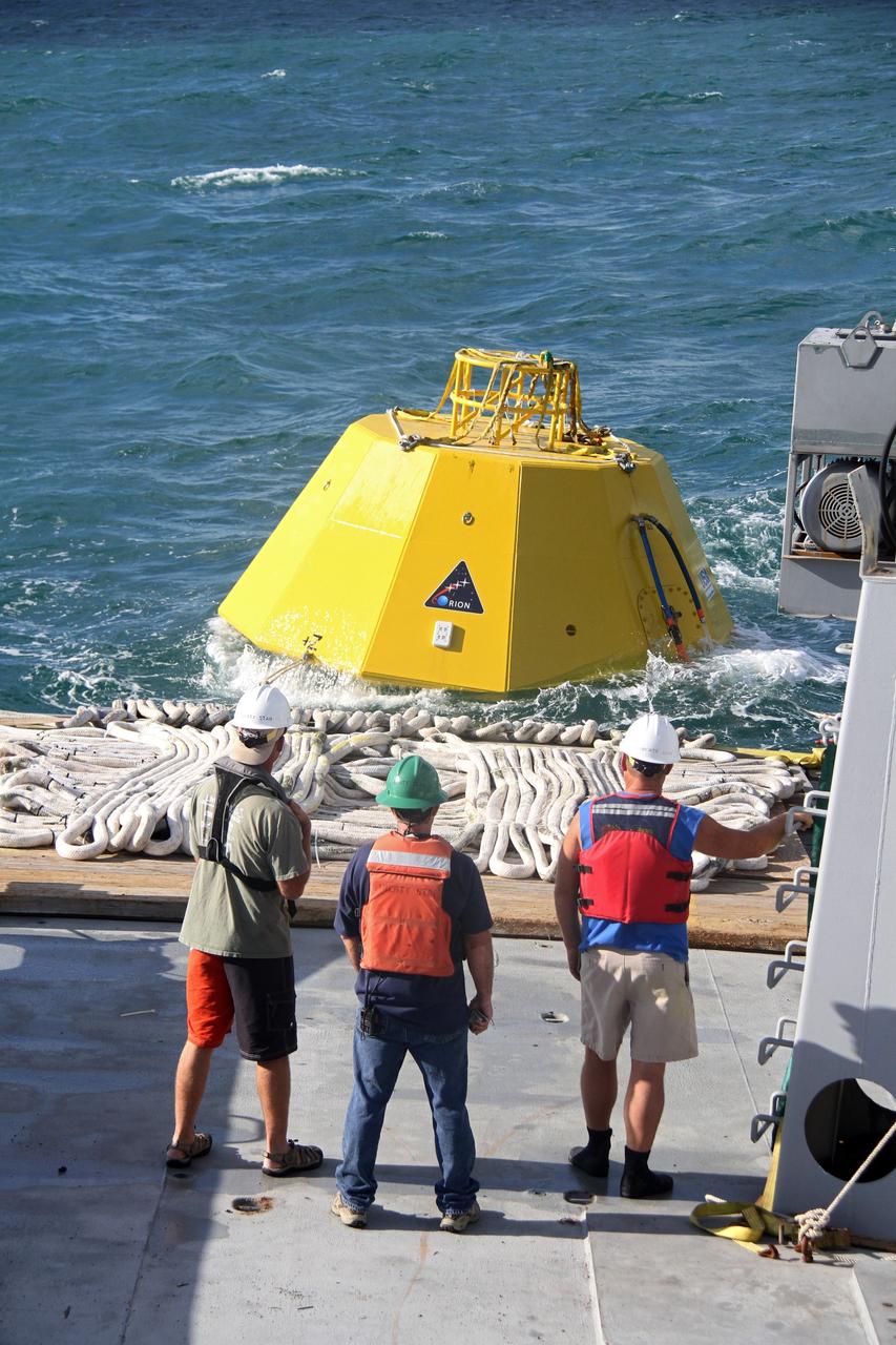 CAPE CANAVERAL, Fla. – Workers on the deck of NASA's Liberty Star ship prepare for testing in the Atlantic Ocean of an Orion flight test capsule to begin.    The Crew Module Recovery Attach Fitting Test (CRAFT) on the capsule, which began at-sea operations Nov. 29, is under way.  Multiple attach clips are being evaluated against the current recovery cleat configuration by U.S. Air Force pararescue jumpers (PJs) and a U.S. Navy diver. The 21st Century Ground Systems Program will use data collected from the tests to help develop ground operations support equipment that could be used to recover an uncrewed Orion flight test capsule after splashdown. The Orion Multi-Purpose Crew Vehicle is NASA's next-generation spacecraft being developed for deep space missions to asteroids, moons and other interplanetary destinations throughout the solar system. For more information, visit http://www.nasa.gov/orion. Photo credit: NASA/Cory Huston