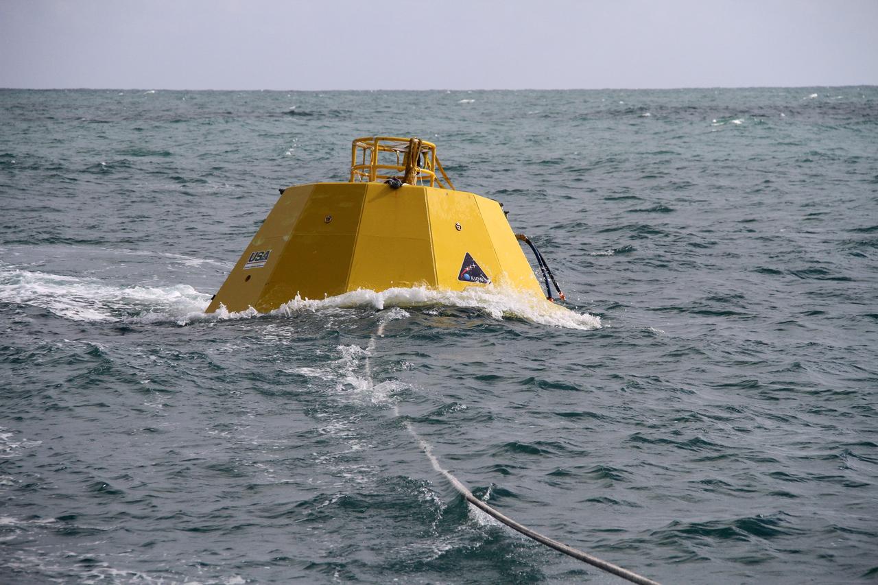 CAPE CANAVERAL, Fla. – Testing is under way on an Orion flight test capsule in the Atlantic Ocean. The tests are being monitored by workers aboard NASA's Liberty Star ship. The Crew Module Recovery Attach Fitting Test (CRAFT) on the capsule, which began at-sea operations Nov. 29, is under way. Multiple attach clips are being evaluated against the current recovery cleat configuration by U.S. Air Force pararescue jumpers (PJs) and a U.S. Navy diver. The 21st Century Ground Systems Program will use data collected from the tests to help develop ground operations support equipment that could be used to recover an uncrewed Orion flight test capsule after splashdown. The Orion Multi-Purpose Crew Vehicle is NASA's next-generation spacecraft being developed for deep space missions to asteroids, moons and other interplanetary destinations throughout the solar system. For more information, visit http://www.nasa.gov/orion. Photo credit: NASA/Cory Huston