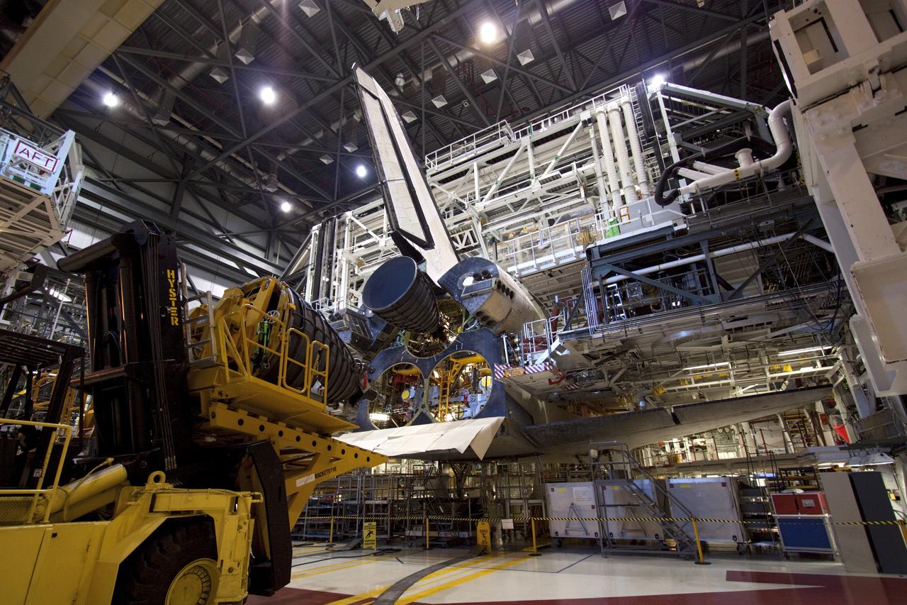 CAPE CANAVERAL, Fla. – Preparations are under way to install a replica shuttle main engine (RSME) on space shuttle Discovery in Orbiter Processing Facility-1 at NASA’s Kennedy Space Center in Florida.    The RSME is one of three that will be installed on Discovery during Space Shuttle Program transition and retirement activities. The replicas are being built in the Pratt & Whitney Rocketdyne engine shop at Kennedy to replace the shuttle engines which will be placed in storage to support NASA's Space Launch System, under development. Discovery is being prepared for display at the Smithsonian’s National Air and Space Museum Steven F. Udvar-Hazy Center in Chantilly, Va. For more information, visit http://www.nasa.gov/shuttle.  Photo credit: NASA/Jim Grossmann