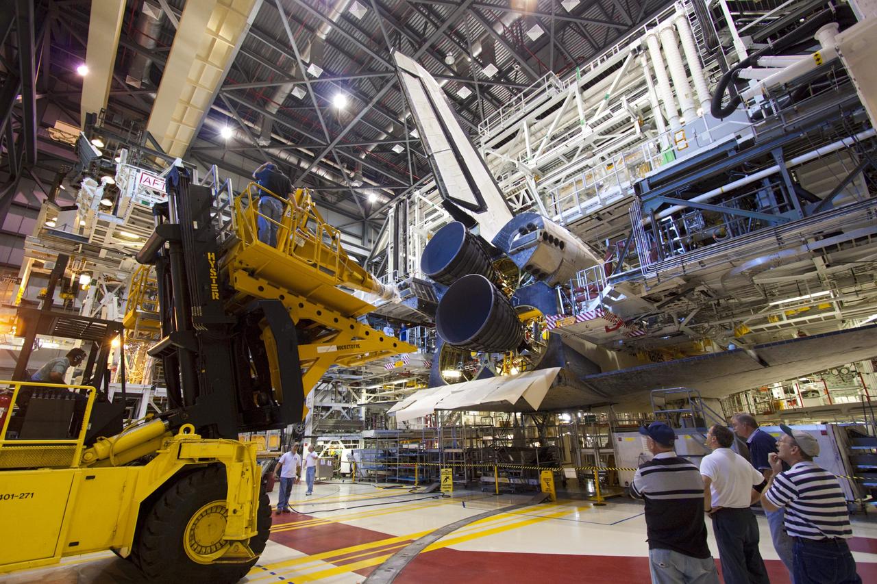 CAPE CANAVERAL, Fla. – Placement of a replica shuttle main engine (RSME) on space shuttle Discovery is complete in Orbiter Processing Facility-1 at NASA’s Kennedy Space Center in Florida.    The RSME is one of three that will be installed on Discovery during Space Shuttle Program transition and retirement activities. The replicas are being built in the Pratt & Whitney Rocketdyne engine shop at Kennedy to replace the shuttle engines which will be placed in storage to support NASA's Space Launch System, under development. Discovery is being prepared for display at the Smithsonian’s National Air and Space Museum Steven F. Udvar-Hazy Center in Chantilly, Va. For more information, visit http://www.nasa.gov/shuttle.  Photo credit: NASA/Jim Grossmann
