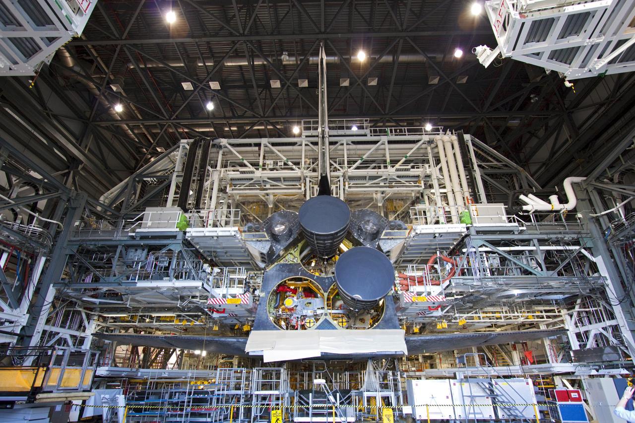 CAPE CANAVERAL, Fla. – Space shuttle Discovery sports two replica shuttle main engines (RSMEs) in Orbiter Processing Facility-1 at NASA’s Kennedy Space Center in Florida. Three RSMEs will be installed on Discovery during Space Shuttle Program transition and retirement activities. The replicas are being built in the Pratt & Whitney Rocketdyne engine shop at Kennedy to replace the shuttle engines which will be placed in storage to support NASA's Space Launch System, under development. Discovery is being prepared for display at the Smithsonian’s National Air and Space Museum Steven F. Udvar-Hazy Center in Chantilly, Va. For more information, visit http://www.nasa.gov/shuttle. Photo credit: NASA/Jim Grossmann