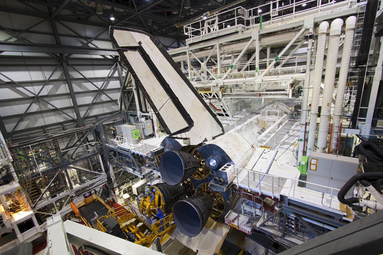 CAPE CANAVERAL, Fla. – In Orbiter Processing Facility-1 at NASA’s Kennedy Space Center in Florida, a replica shuttle main engine (RSME) slides into the engine well of space shuttle Discovery with the aid of a Hyster forklift, a specially designed engine installer.    The RSME is one of three being installed on Discovery during Space Shuttle Program transition and retirement activities. The replicas are built in the Pratt & Whitney Rocketdyne engine shop at Kennedy to replace the shuttle engines which will be placed in storage to support NASA's Space Launch System, under development. Discovery is being prepared for display at the Smithsonian’s National Air and Space Museum Steven F. Udvar-Hazy Center in Chantilly, Va. For more information, visit http://www.nasa.gov/shuttle.  Photo credit: NASA/Jim Grossmann