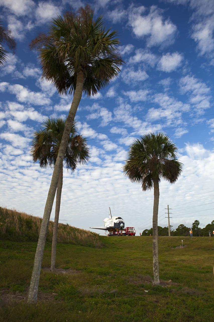 CAPE CANAVERAL, Fla. – The high-fidelity space shuttle model that was on display at the NASA Kennedy Space Center Visitor Complex in Florida uses the on-ramp at the intersection of NASA Causeway and Kennedy Parkway to gain entrance to the northbound roadways on the center.  It is standard procedure for large payloads and equipment to travel against the normal flow of traffic under the supervision of a move crew when being transported on or off center property. The model is being moved from the visitor complex to NASA Kennedy Space Center's Launch Complex 39 turn basin.  The shuttle was part of a display at the visitor complex that also included an external tank and two solid rocket boosters that were used to show visitors the size of actual space shuttle components. The full-scale shuttle model is being transferred from Kennedy to Space Center Houston, NASA Johnson Space Center's visitor center. The model will stay at the turn basin for a few months until it is ready to be transported to Texas via barge. The move also helps clear the way for the Kennedy Space Center Visitor Complex to begin construction of a new facility next year to display space shuttle Atlantis in 2013.  For more information about Space Center Houston, visit http://www.spacecenter.org.  Photo credit: NASA/Dimitri Gerondidakis