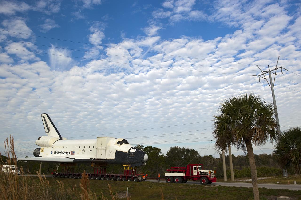 CAPE CANAVERAL, Fla. – The high-fidelity space shuttle model that was on display at the NASA Kennedy Space Center Visitor Complex in Florida creeps along the on-ramp from NASA Causeway to Kennedy Parkway to gain entrance to the northbound roadways on the center.  It is standard procedure for large payloads and equipment to travel against the normal flow of traffic under the supervision of a move crew when being transported on or off center property. The model is being moved from the visitor complex to NASA Kennedy Space Center's Launch Complex 39 turn basin.  The shuttle was part of a display at the visitor complex that also included an external tank and two solid rocket boosters that were used to show visitors the size of actual space shuttle components. The full-scale shuttle model is being transferred from Kennedy to Space Center Houston, NASA Johnson Space Center's visitor center. The model will stay at the turn basin for a few months until it is ready to be transported to Texas via barge. The move also helps clear the way for the Kennedy Space Center Visitor Complex to begin construction of a new facility next year to display space shuttle Atlantis in 2013.  For more information about Space Center Houston, visit http://www.spacecenter.org.  Photo credit: NASA/Dimitri Gerondidakis