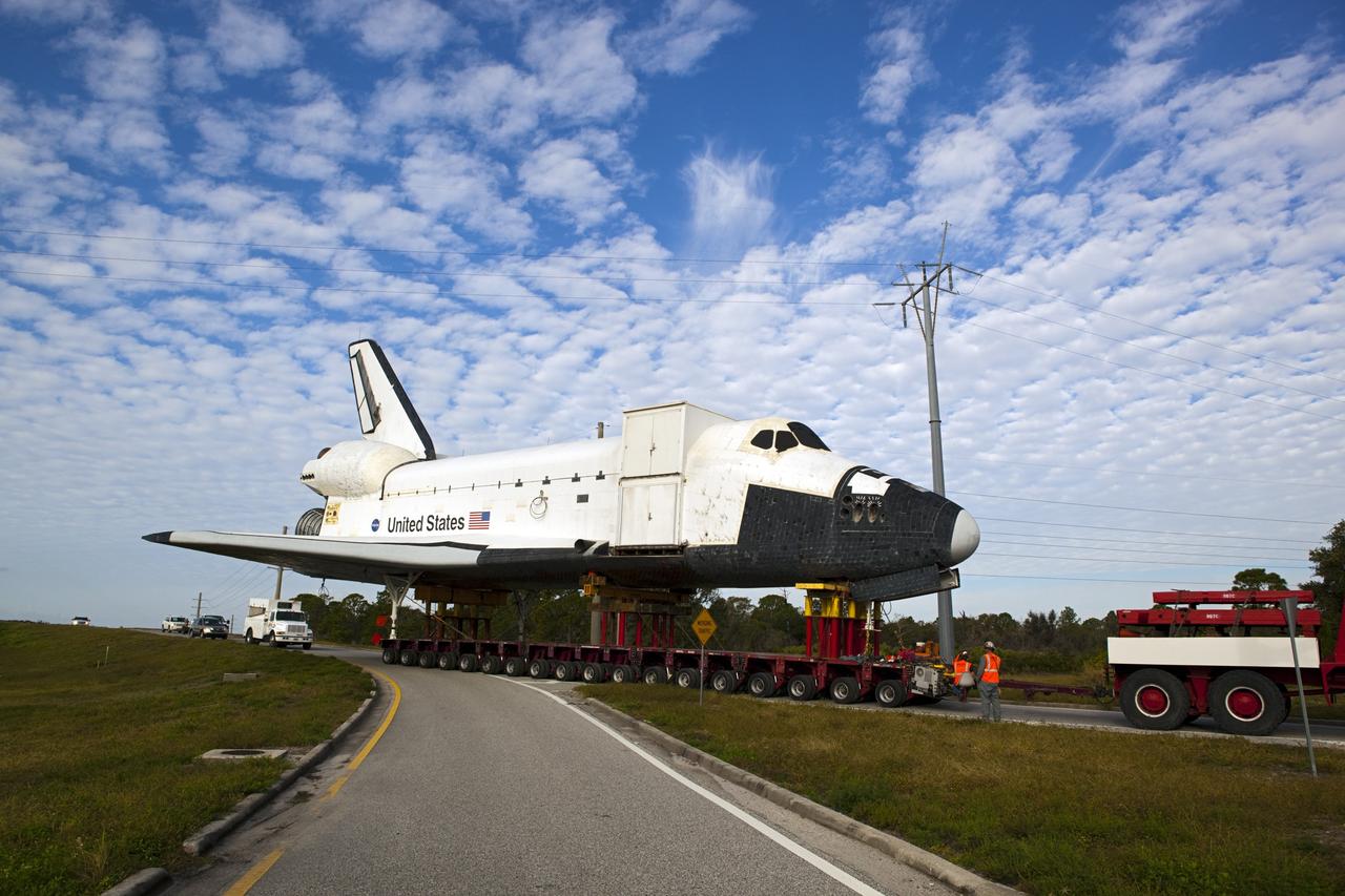CAPE CANAVERAL, Fla. – The high-fidelity space shuttle model that was on display at the NASA Kennedy Space Center Visitor Complex in Florida monopolizes the on-ramp at the intersection of NASA Causeway and Kennedy Parkway to gain entrance to the northbound roadways on the center.  It is standard procedure for large payloads and equipment to travel against the normal flow of traffic under the supervision of a move crew when being transported on or off center property. The model is being moved from the visitor complex to NASA Kennedy Space Center's Launch Complex 39 turn basin.  The shuttle was part of a display at the visitor complex that also included an external tank and two solid rocket boosters that were used to show visitors the size of actual space shuttle components. The full-scale shuttle model is being transferred from Kennedy to Space Center Houston, NASA Johnson Space Center's visitor center. The model will stay at the turn basin for a few months until it is ready to be transported to Texas via barge. The move also helps clear the way for the Kennedy Space Center Visitor Complex to begin construction of a new facility next year to display space shuttle Atlantis in 2013.  For more information about Space Center Houston, visit http://www.spacecenter.org.  Photo credit: NASA/Dimitri Gerondidakis